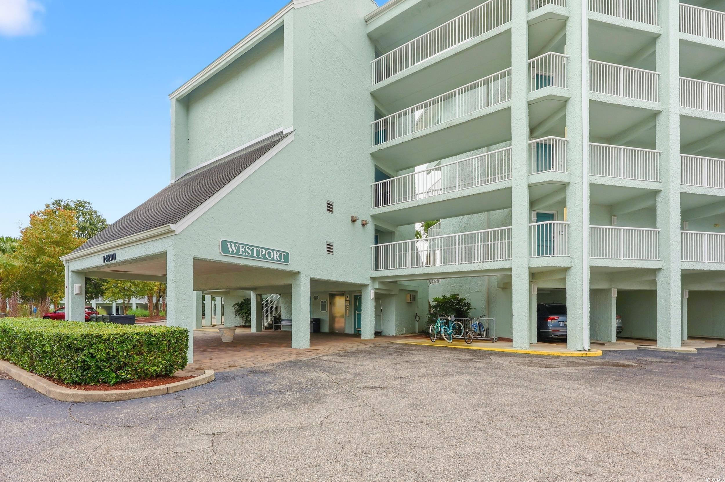 Image 2: View of apartment building / complex featuring cov Image 2: View of apartment building / complex featuring cov
