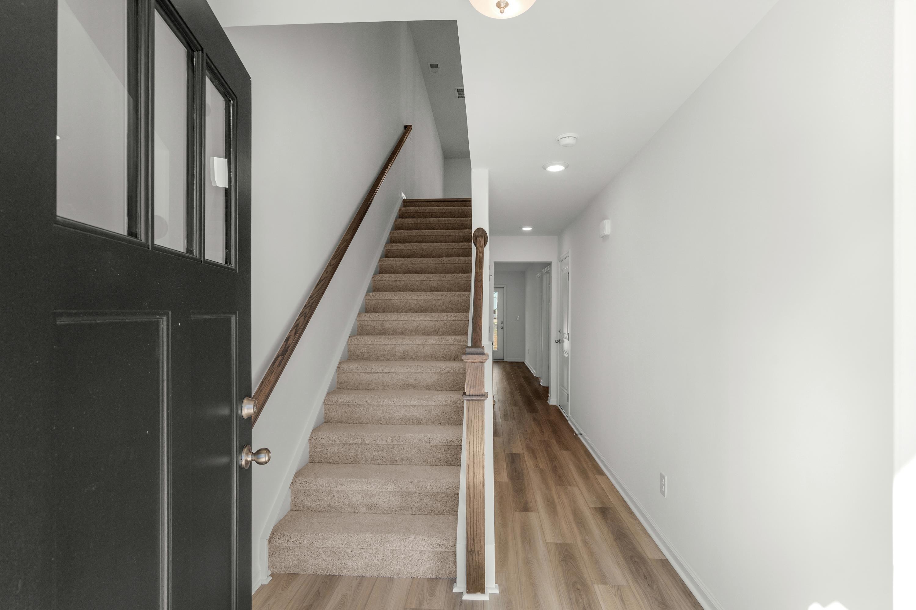 Image 2: Staircase featuring wood finished floors and reces