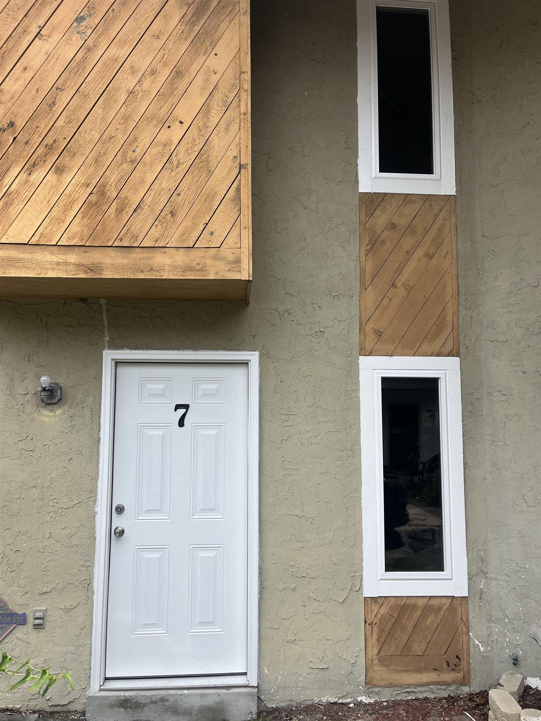 Image 2: View of exterior entry featuring stucco siding Image 2: View of exterior entry featuring stucco siding