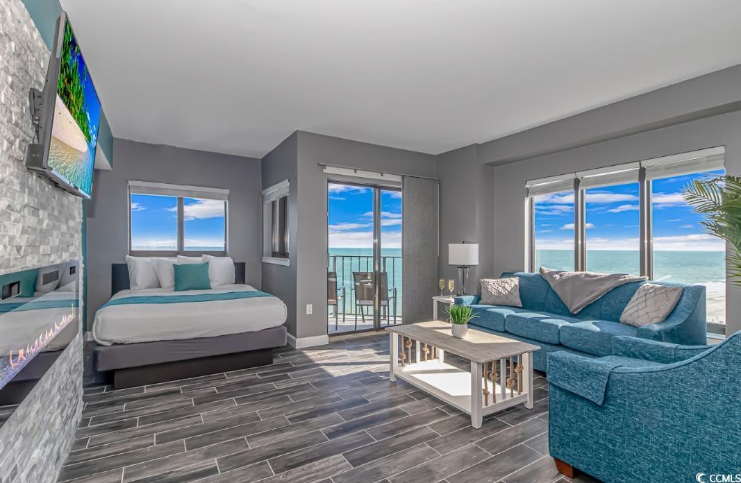 Image 4: Bedroom featuring a water view, access to outside, Image 4: Bedroom featuring a water view, access to outside,
