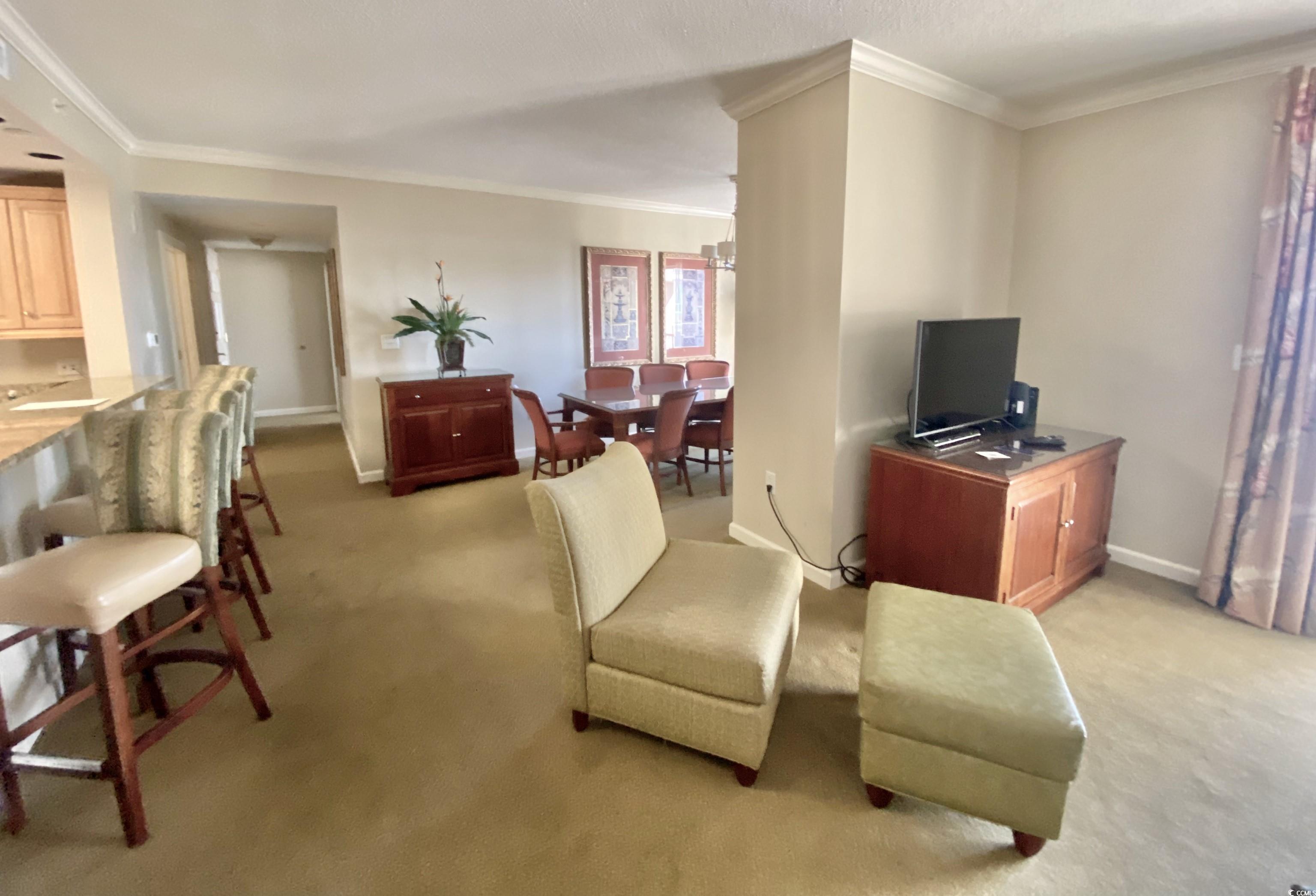 Image 3: Carpeted living room with crown molding Image 3: Carpeted living room with crown molding