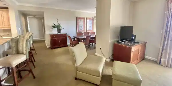 Image 3: Carpeted living room with crown molding