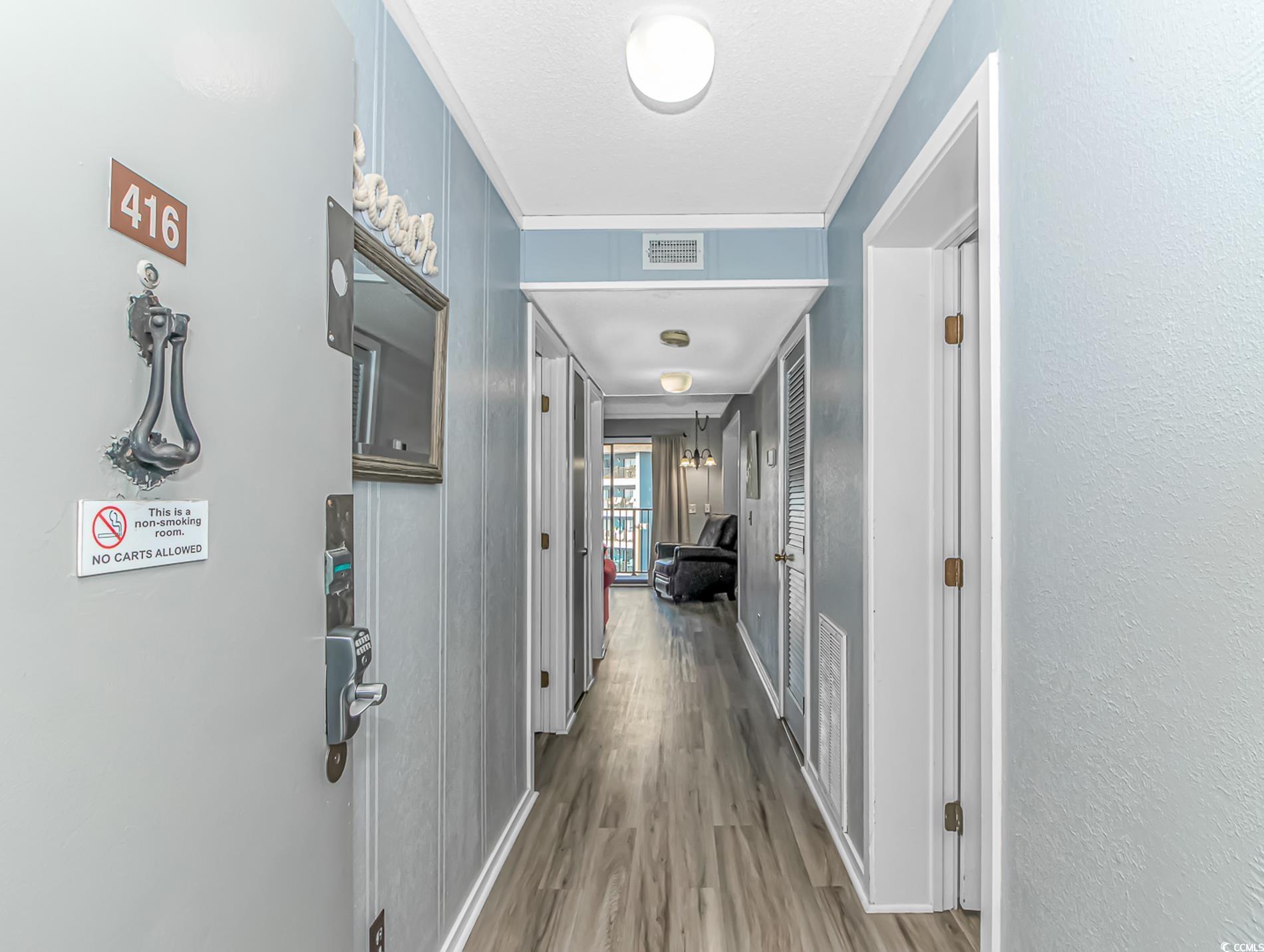 Image 2: Corridor with wood finished floors