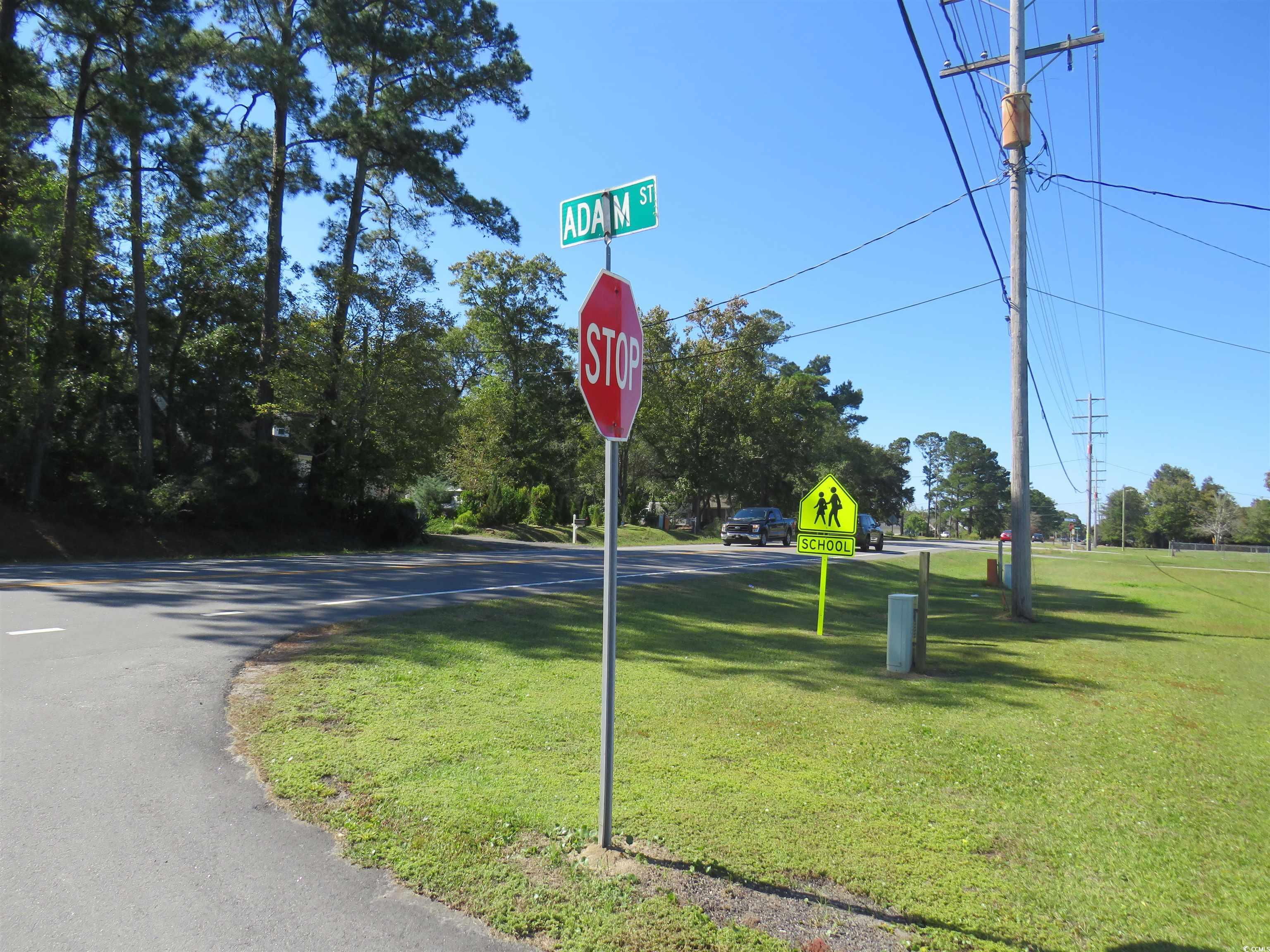 Image 2: View of asphalt road with traffic signs Image 2: View of asphalt road with traffic signs