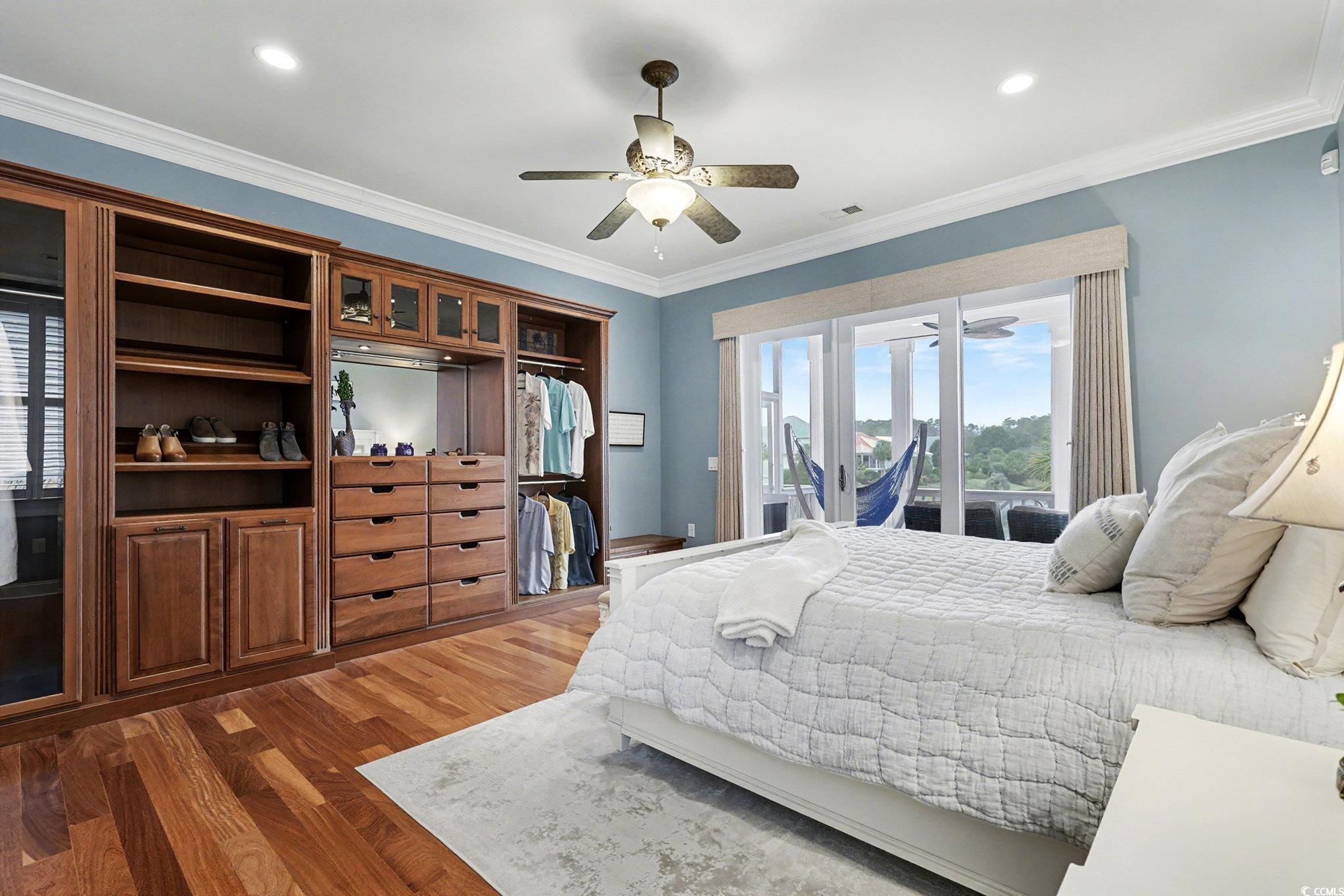 Image 4: Bedroom featuring wood finished floors, access to