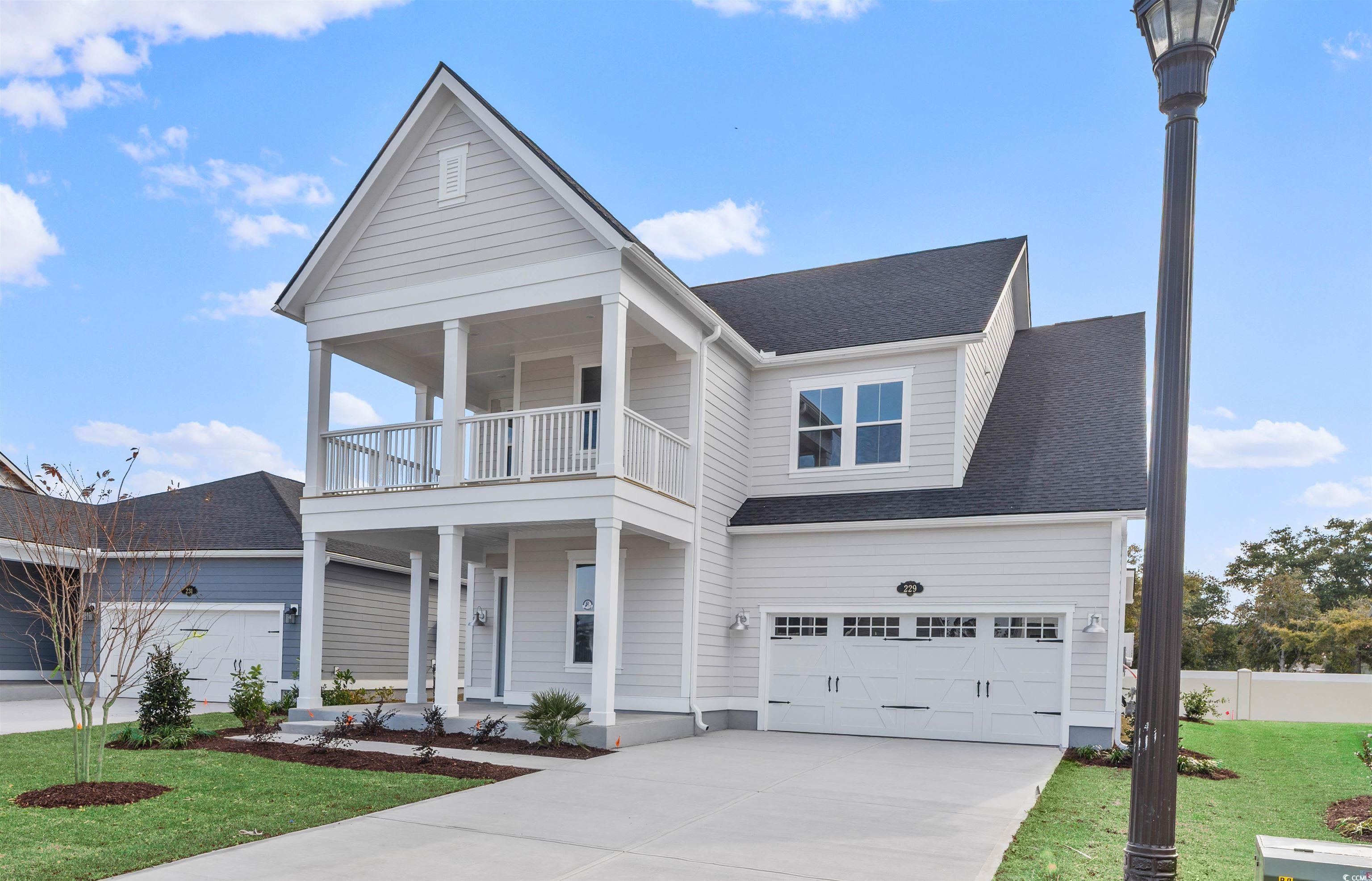 Image 2: View of front facade featuring covered porch, roof Image 2: View of front facade featuring covered porch, roof