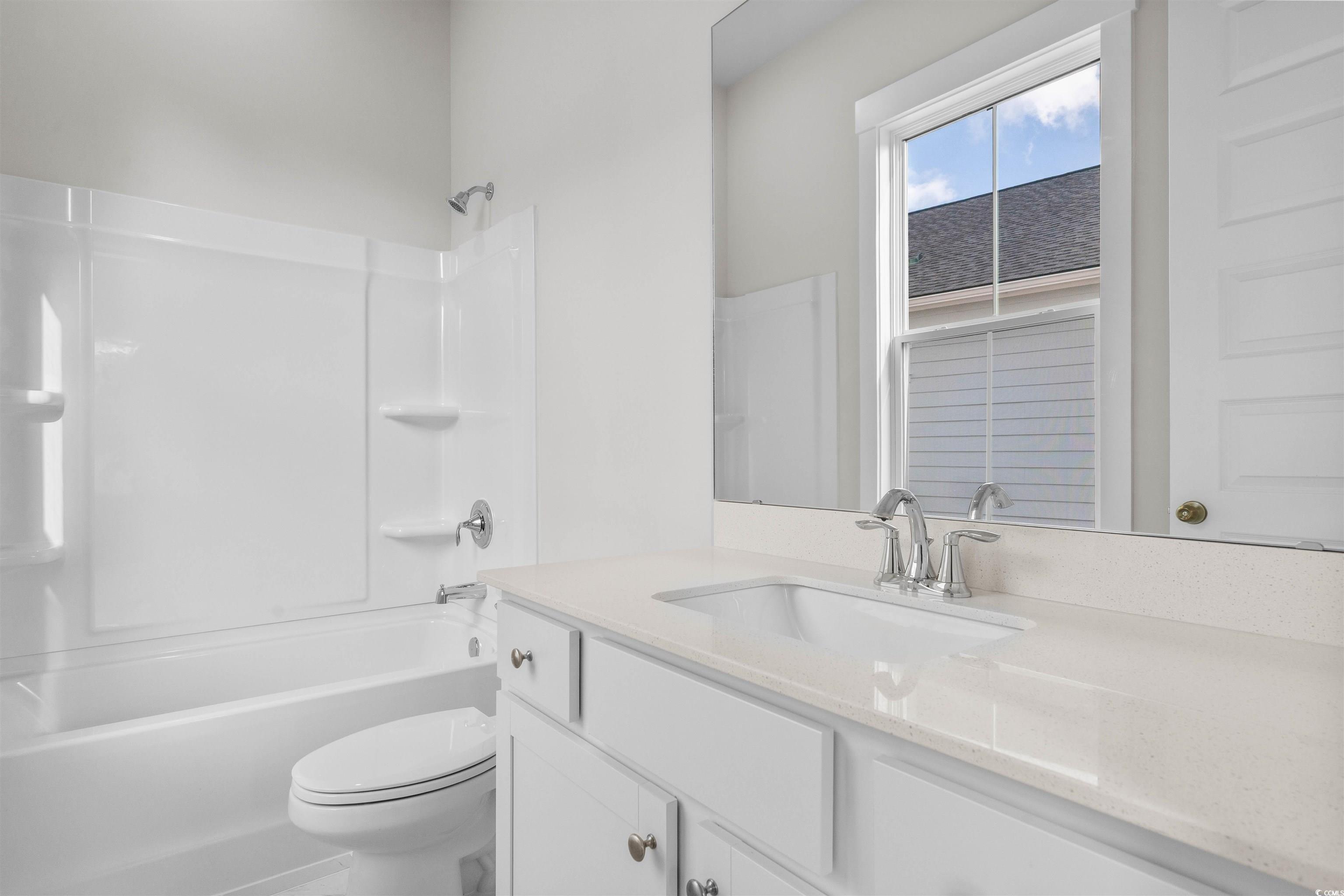 Image 4: Bathroom featuring vanity and shower / washtub com Image 4: Bathroom featuring vanity and shower / washtub com