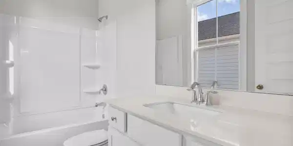 Image 4: Bathroom featuring vanity and shower / washtub com Image 4: Bathroom featuring vanity and shower / washtub com