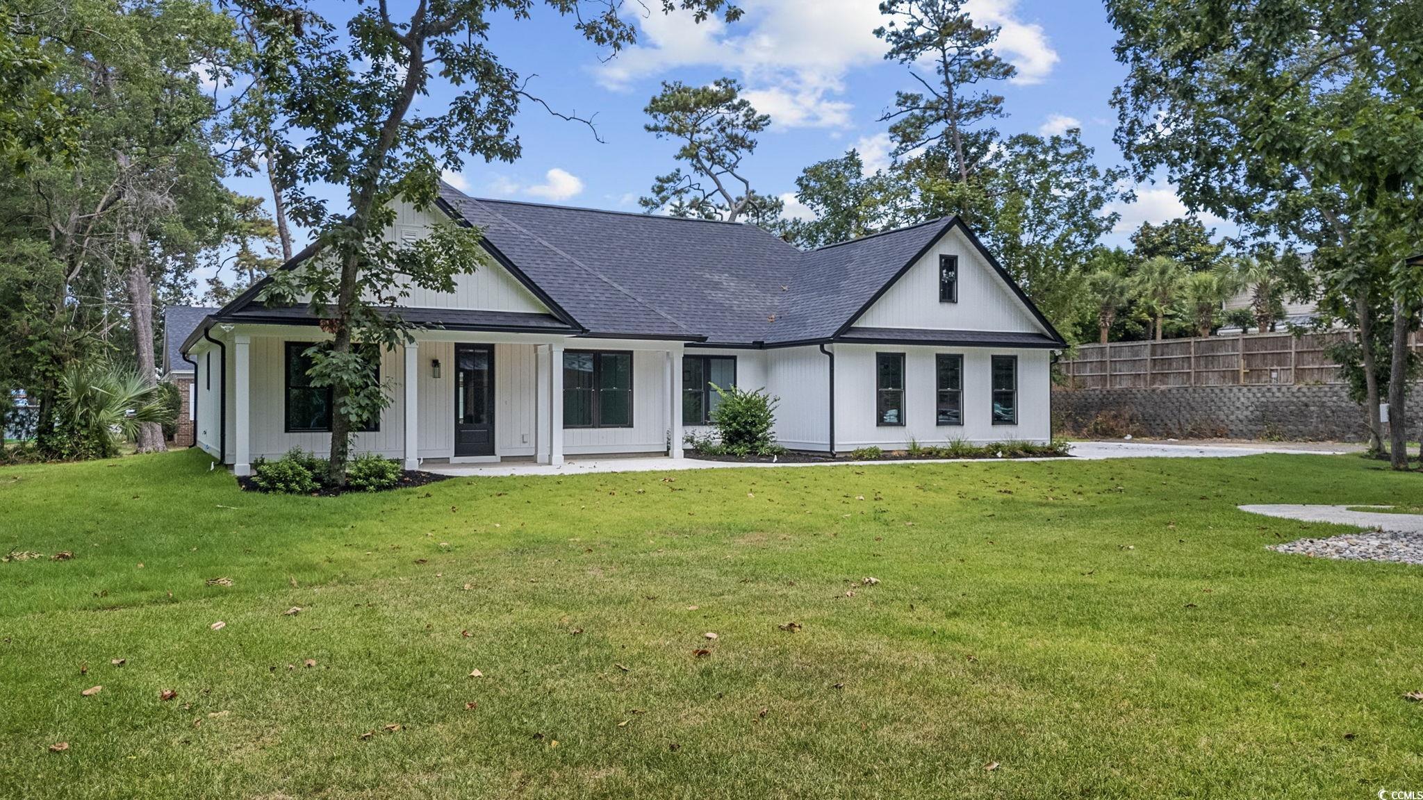 Image 4: View of front facade with a shingled roof Image 4: View of front facade with a shingled roof