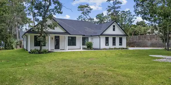 Image 4: View of front facade with a shingled roof Image 4: View of front facade with a shingled roof