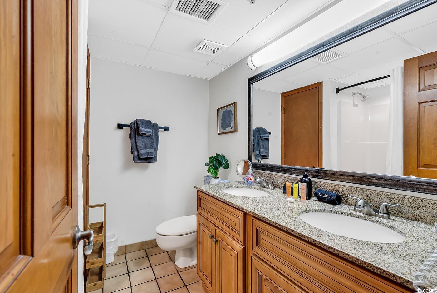 Image 3: Bathroom featuring tile patterned flooring, vanity