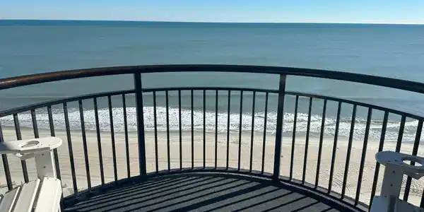 Image 2: Balcony featuring a water view and a beach view Image 2: Balcony featuring a water view and a beach view