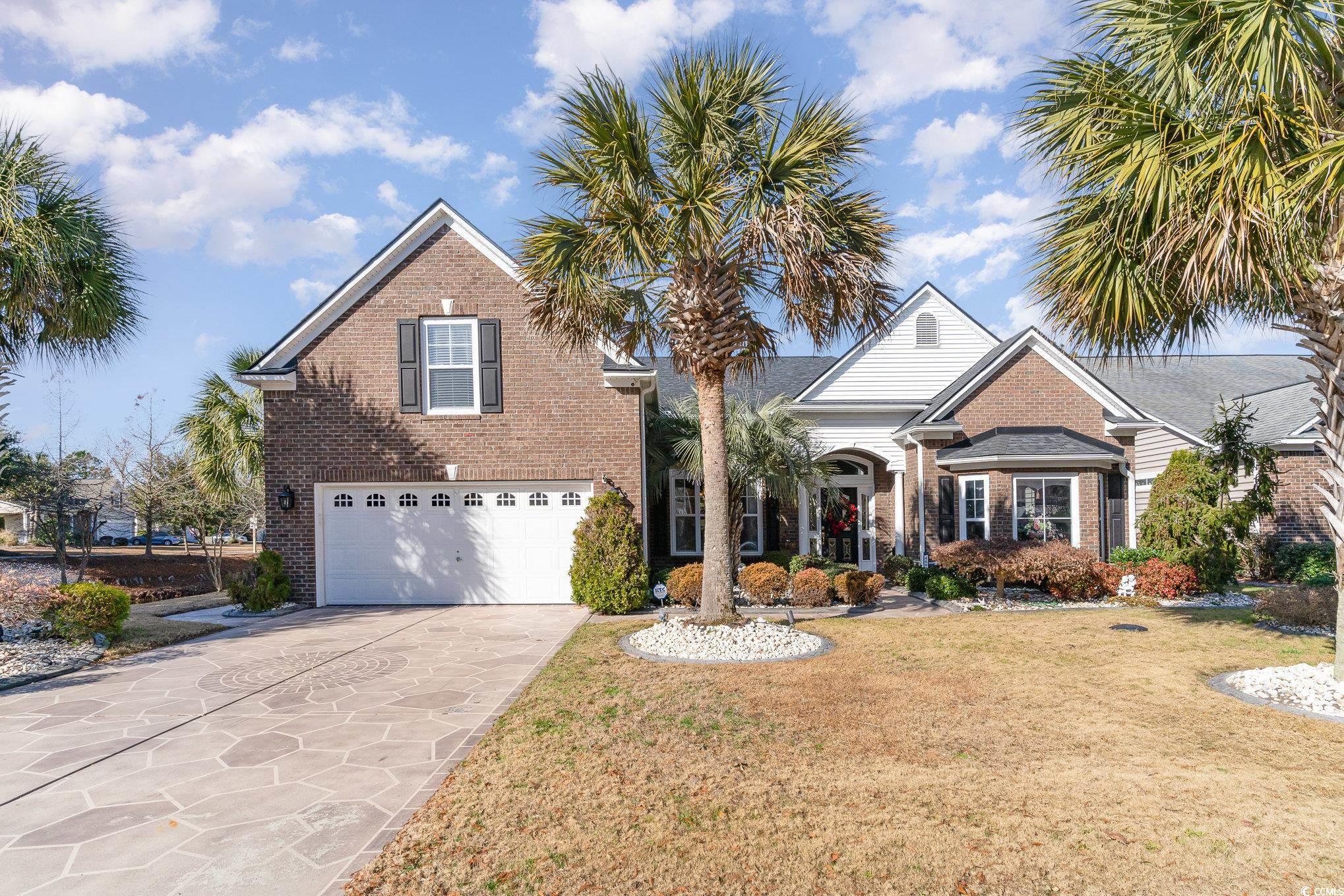 Image 1: Front of the Home with Brick Elevation, Painted Dr