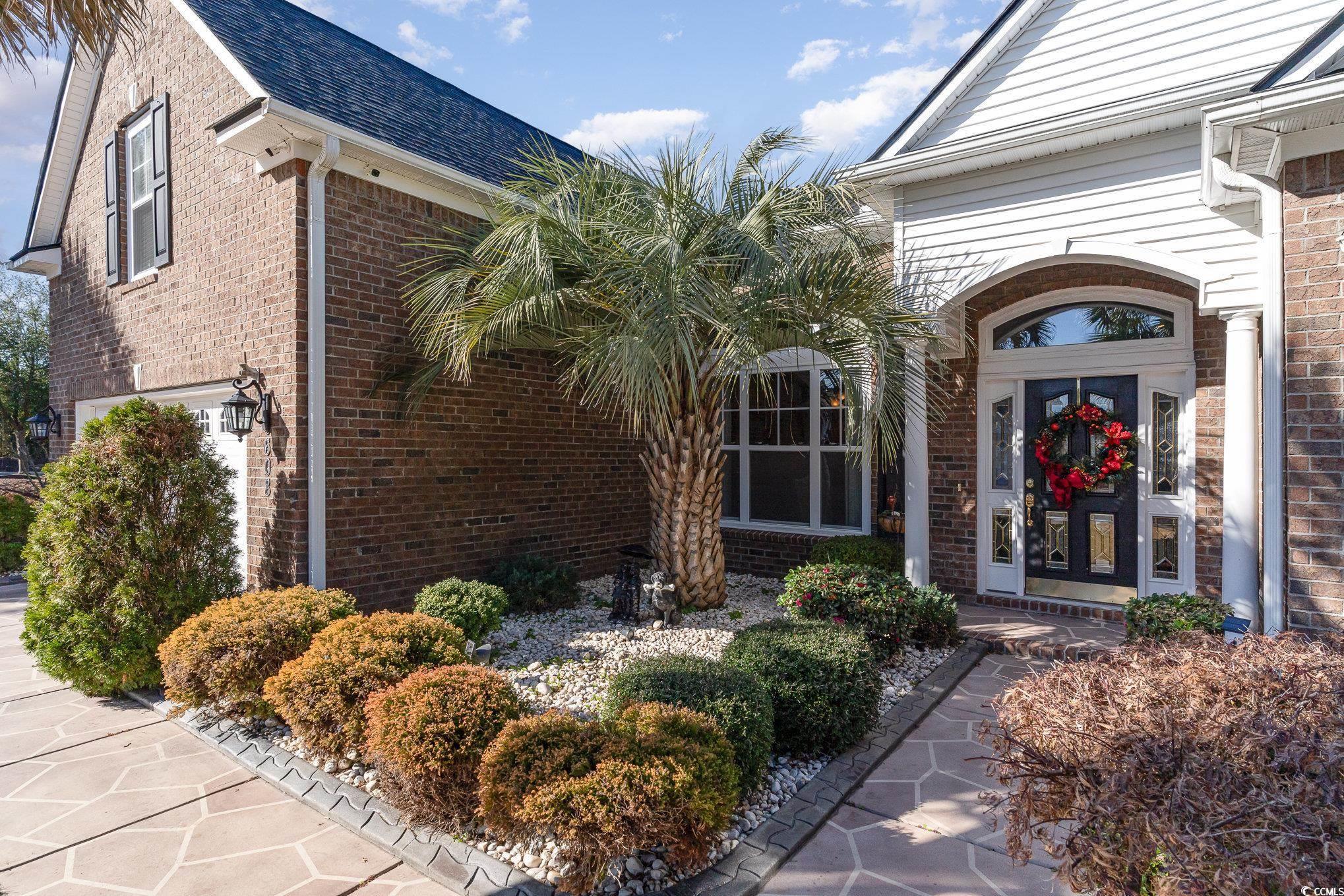 Image 3: Front Door Entry with Painted Walkway and Upgraded