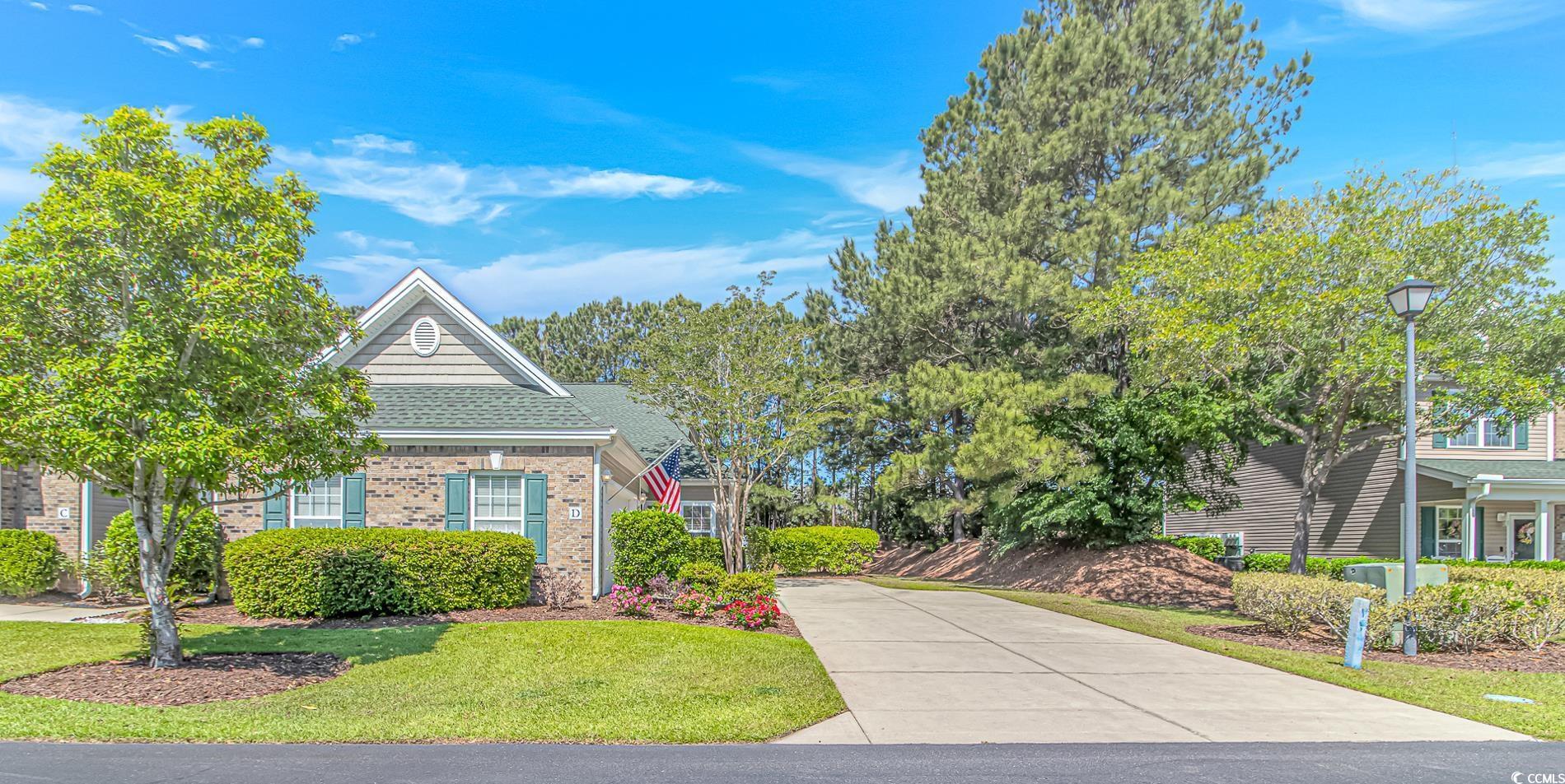 Image 1: View of front of property with brick siding, drive Image 1: View of front of property with brick siding, drive