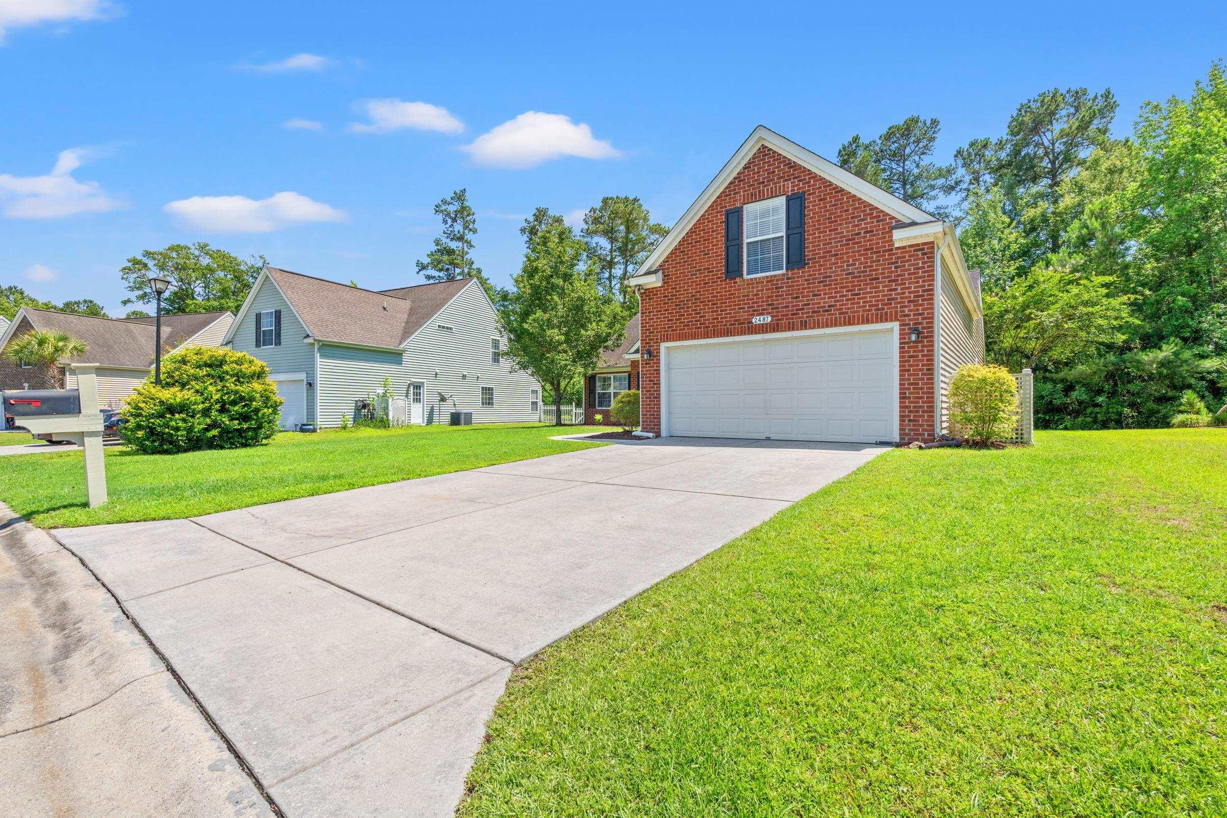 Image 4: View of property exterior featuring brick siding, Image 4: View of property exterior featuring brick siding,