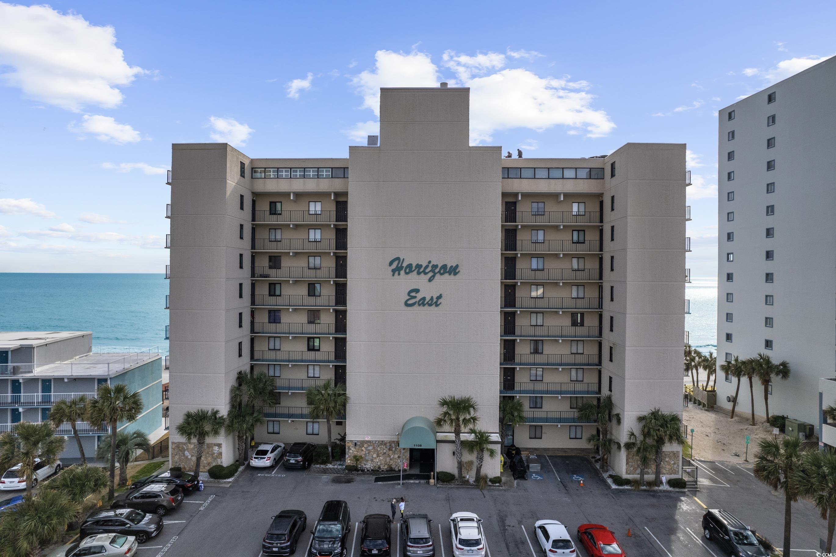 Image 2: View of apartment building / complex with a water Image 2: View of apartment building / complex with a water