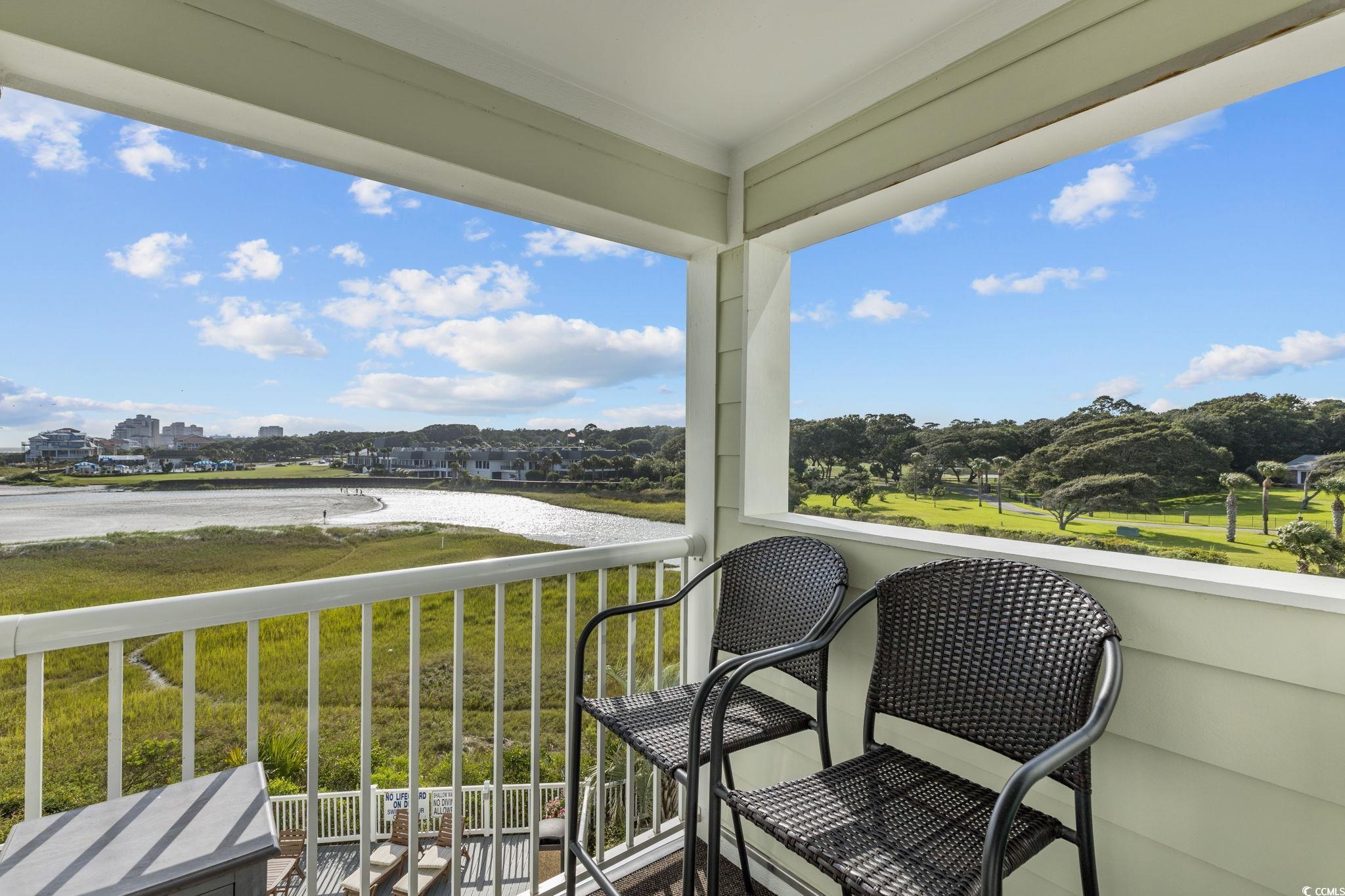 Image 2: Balcony featuring a water view Image 2: Balcony featuring a water view
