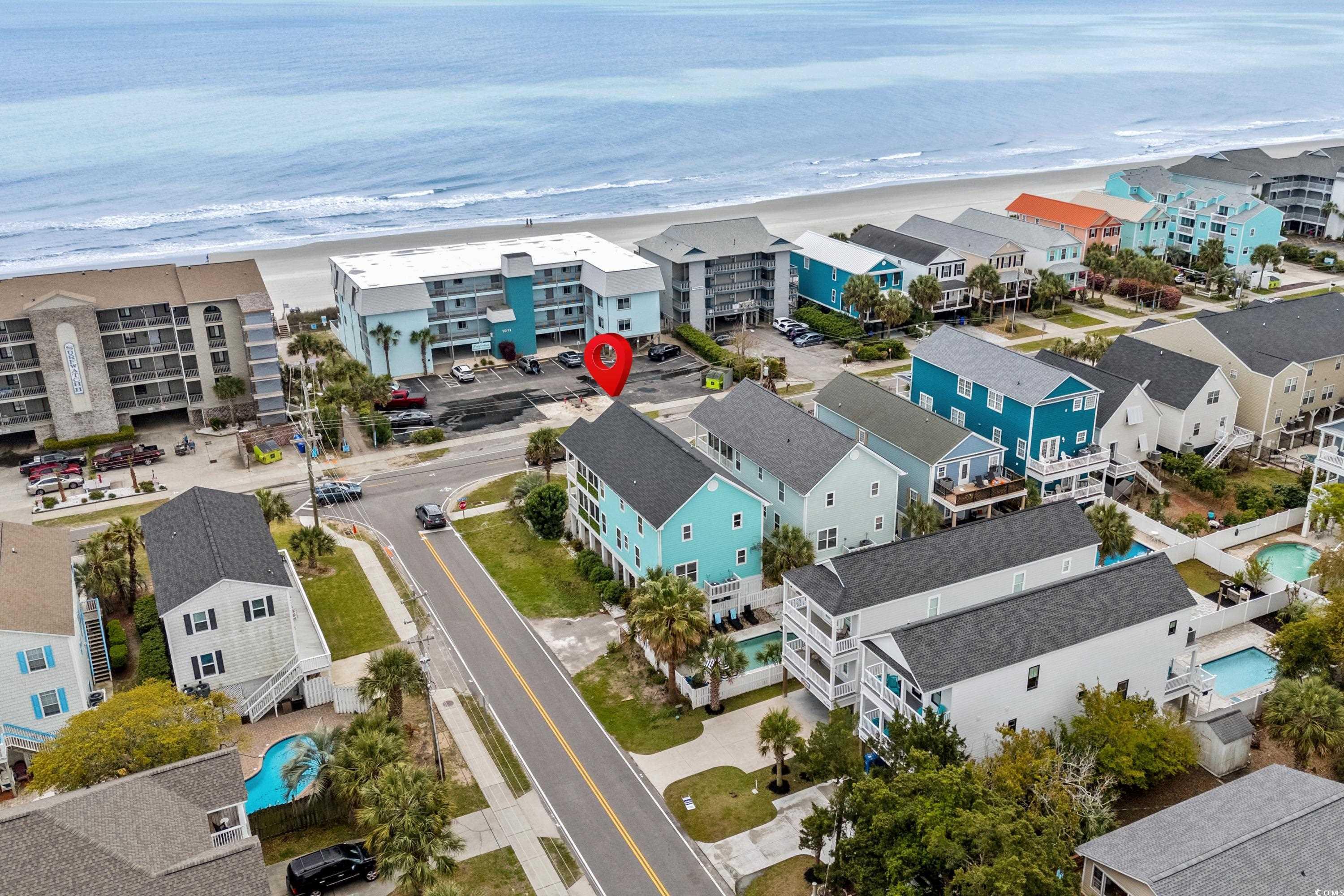 Image 2: Aerial view with a water view and a beach view