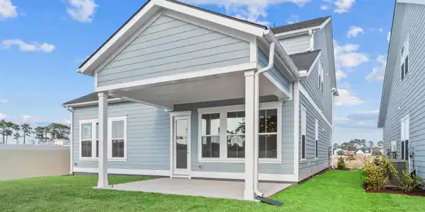 Image 3: Rear view of house with a patio and roof with shin Image 3: Rear view of house with a patio and roof with shin