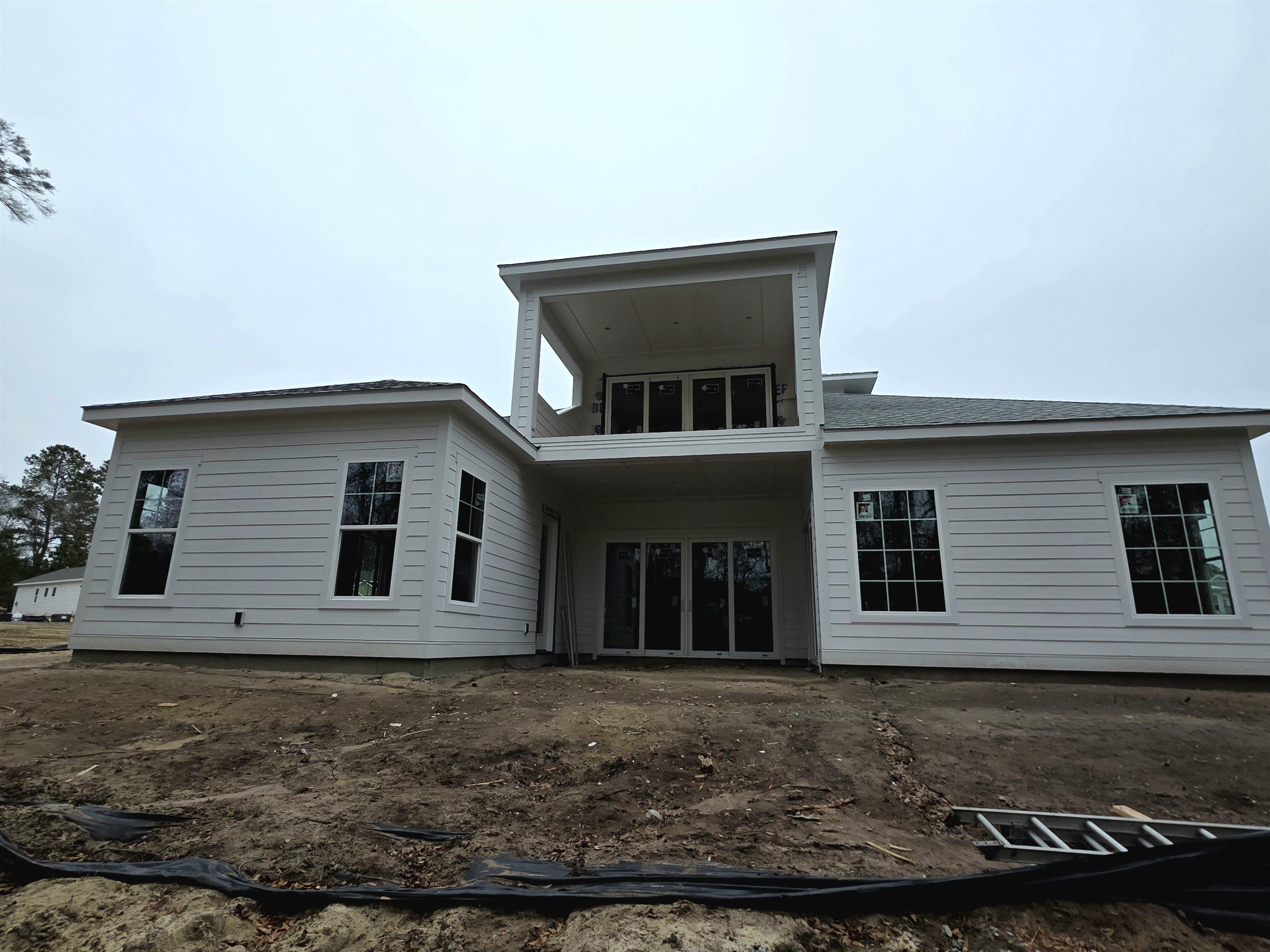 Image 3: Rear view of property with a balcony, a patio area