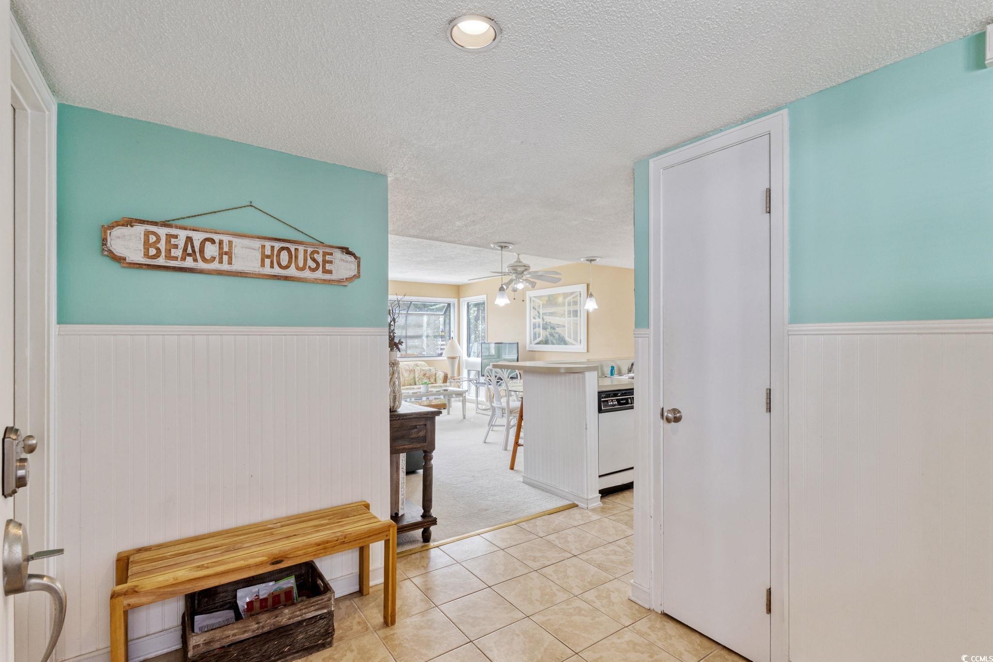 Image 2: Hallway with wainscoting, a textured ceiling, ligh Image 2: Hallway with wainscoting, a textured ceiling, ligh