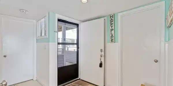 Image 3: Foyer entrance with a textured ceiling, a wainscot Image 3: Foyer entrance with a textured ceiling, a wainscot