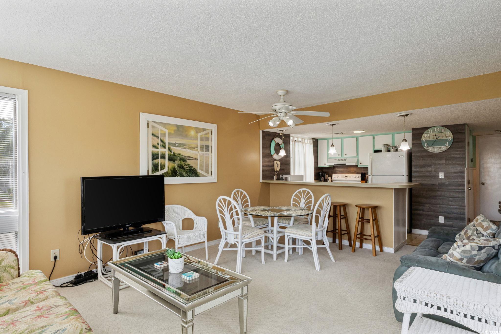 Image 4: Living room with a ceiling fan, light colored carp Image 4: Living room with a ceiling fan, light colored carp