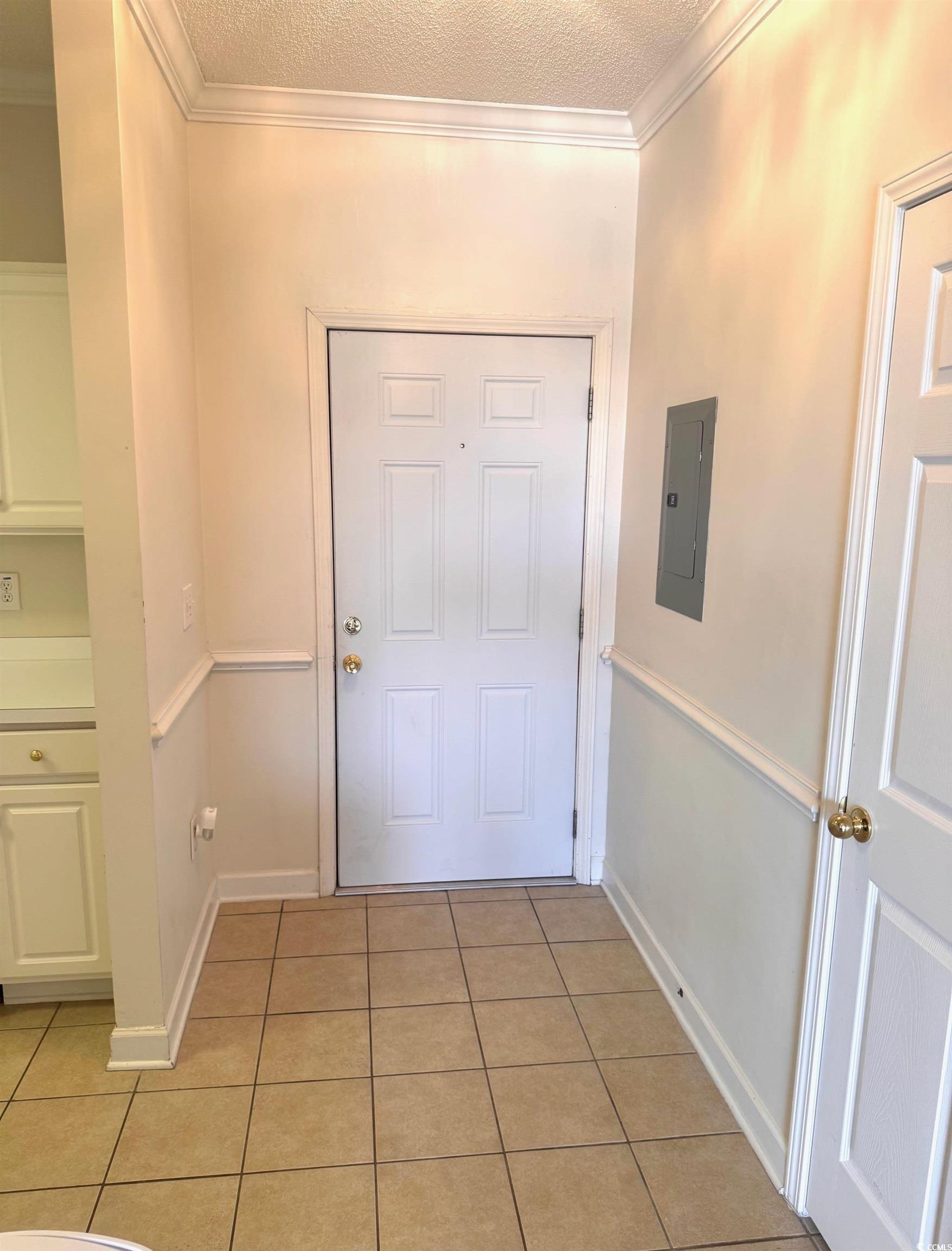 Image 4: Entryway featuring ornamental molding, tile patter