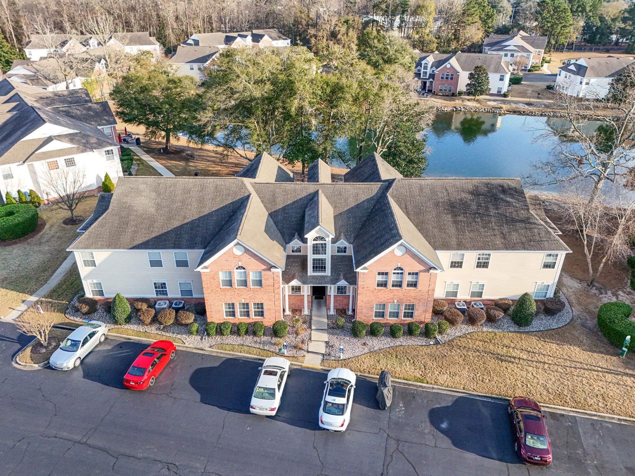 Image 2: Aerial perspective of suburban area with a nearby Image 2: Aerial perspective of suburban area with a nearby