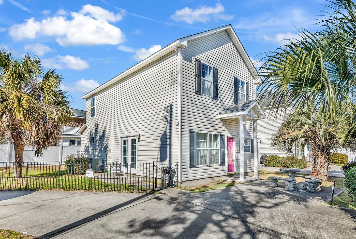 Image 1: View of side of home featuring a central air condi Image 1: View of side of home featuring a central air condi