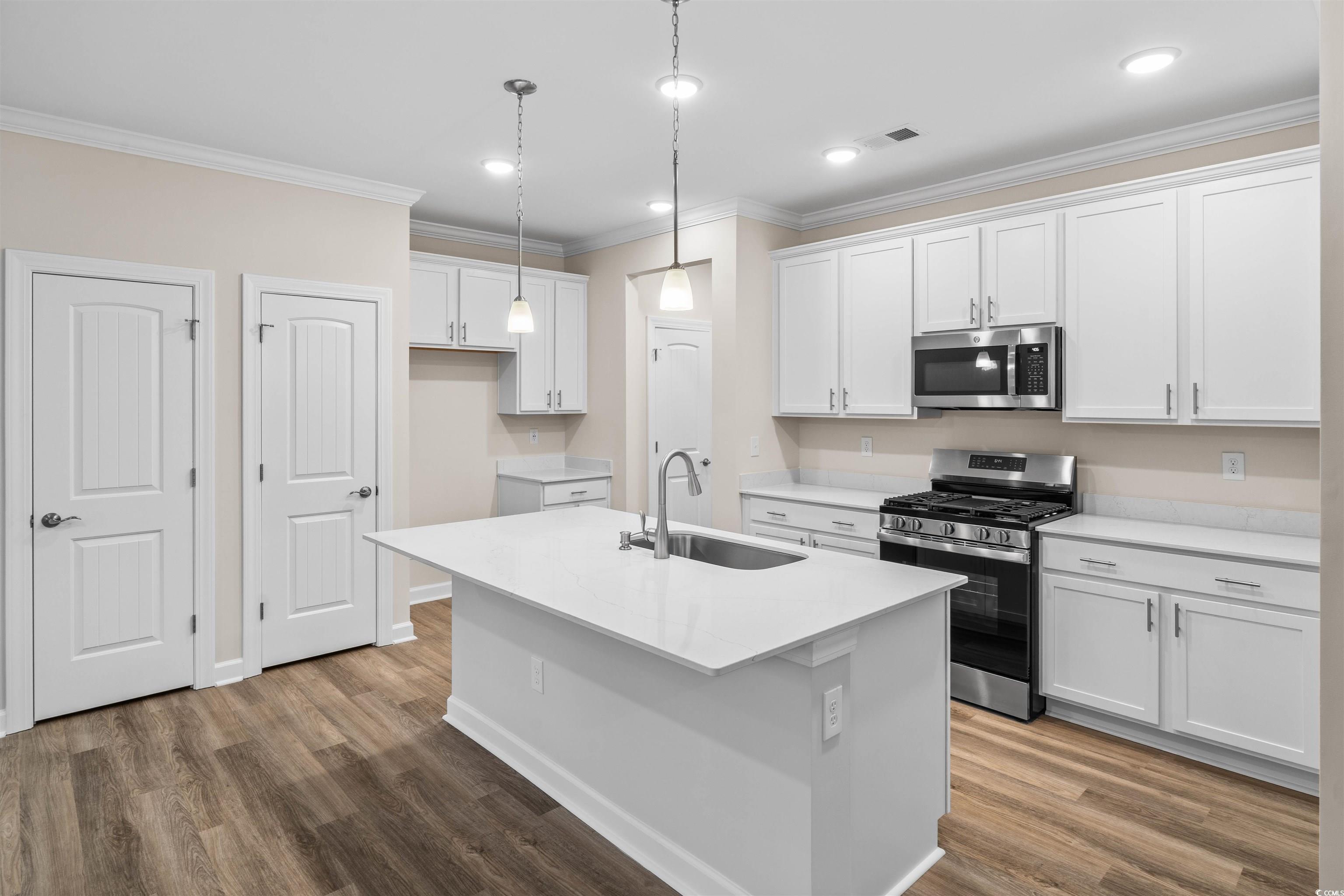 Image 4: Kitchen featuring appliances with stainless steel
