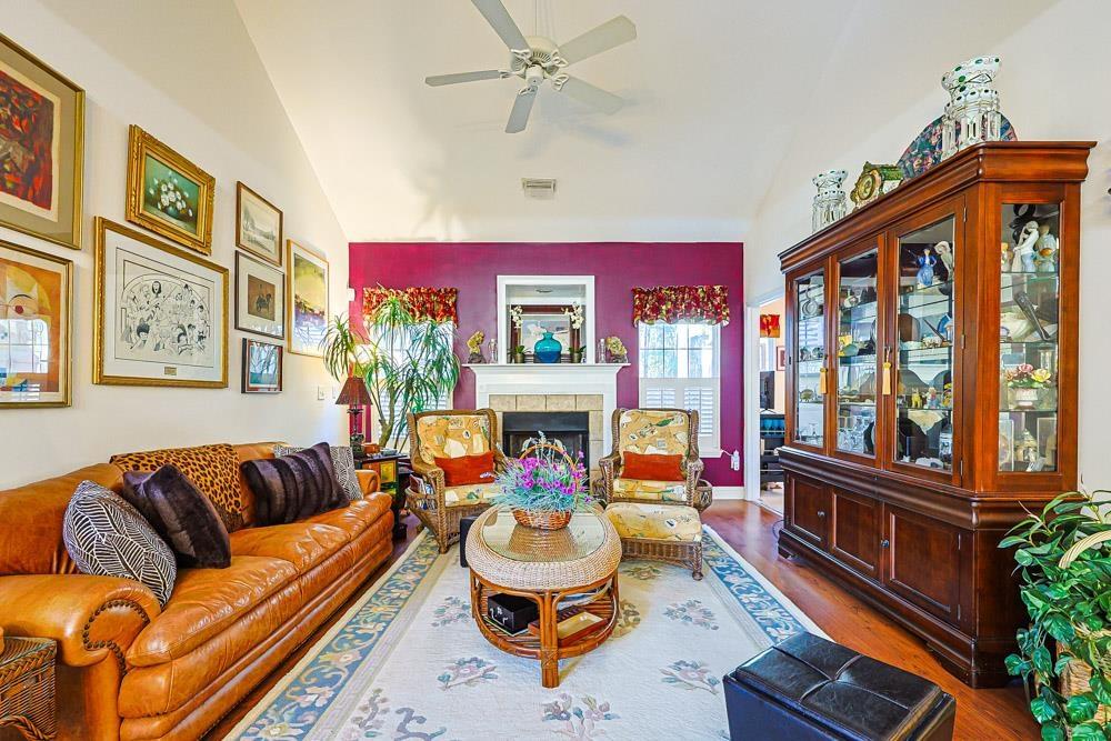 Image 4: Living area featuring lofted ceiling, wood finishe Image 4: Living area featuring lofted ceiling, wood finishe