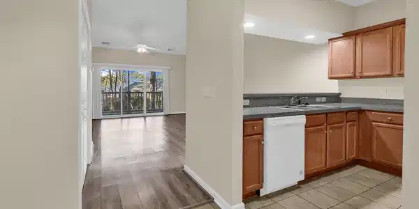 Image 2: Kitchen with brown cabinetry, white dishwasher, li Image 2: Kitchen with brown cabinetry, white dishwasher, li