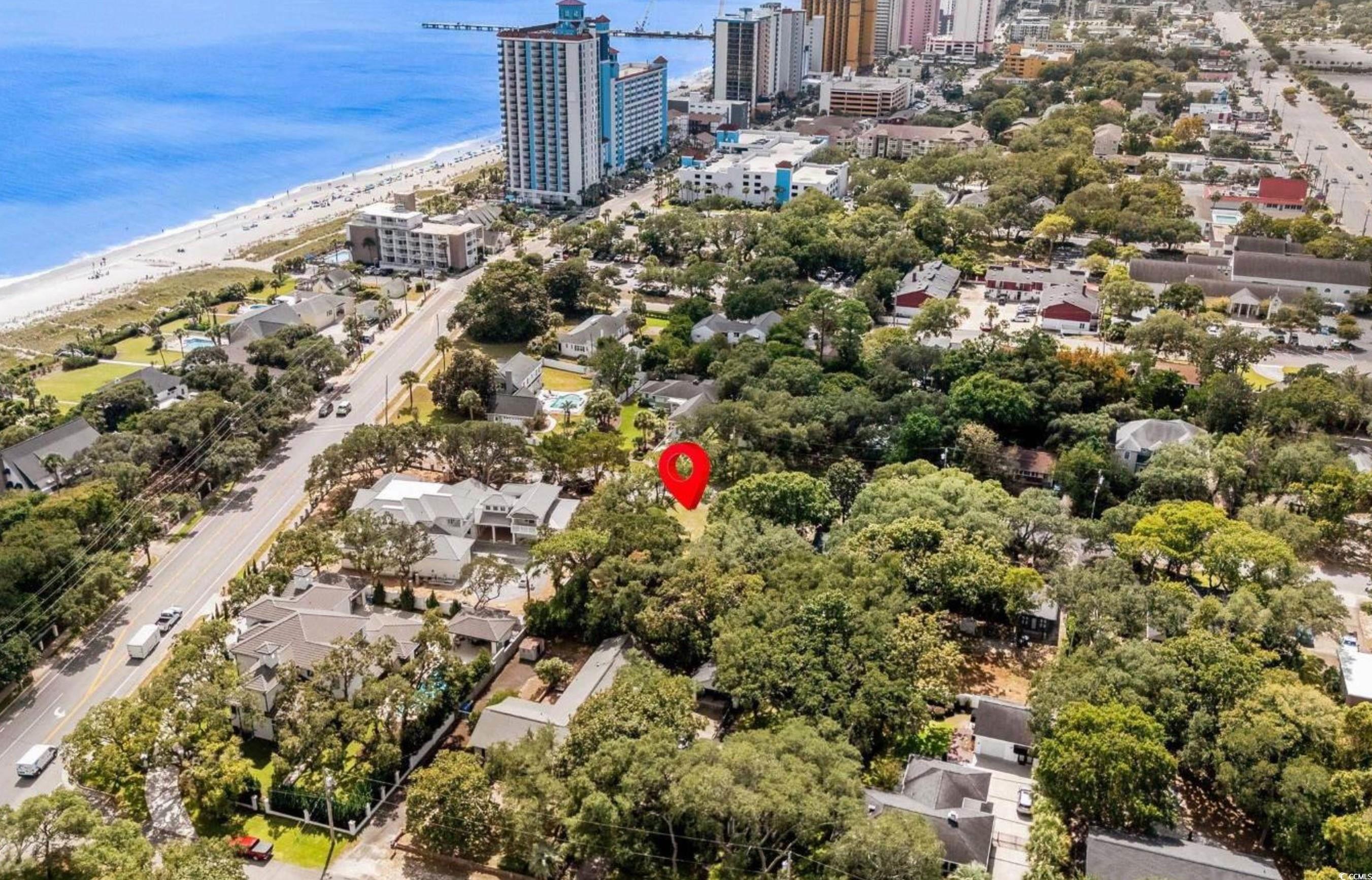Image 2: View of urban area with waterfront with a beach Image 2: View of urban area with waterfront with a beach