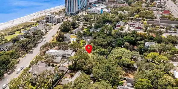 Image 2: View of urban area with waterfront with a beach Image 2: View of urban area with waterfront with a beach