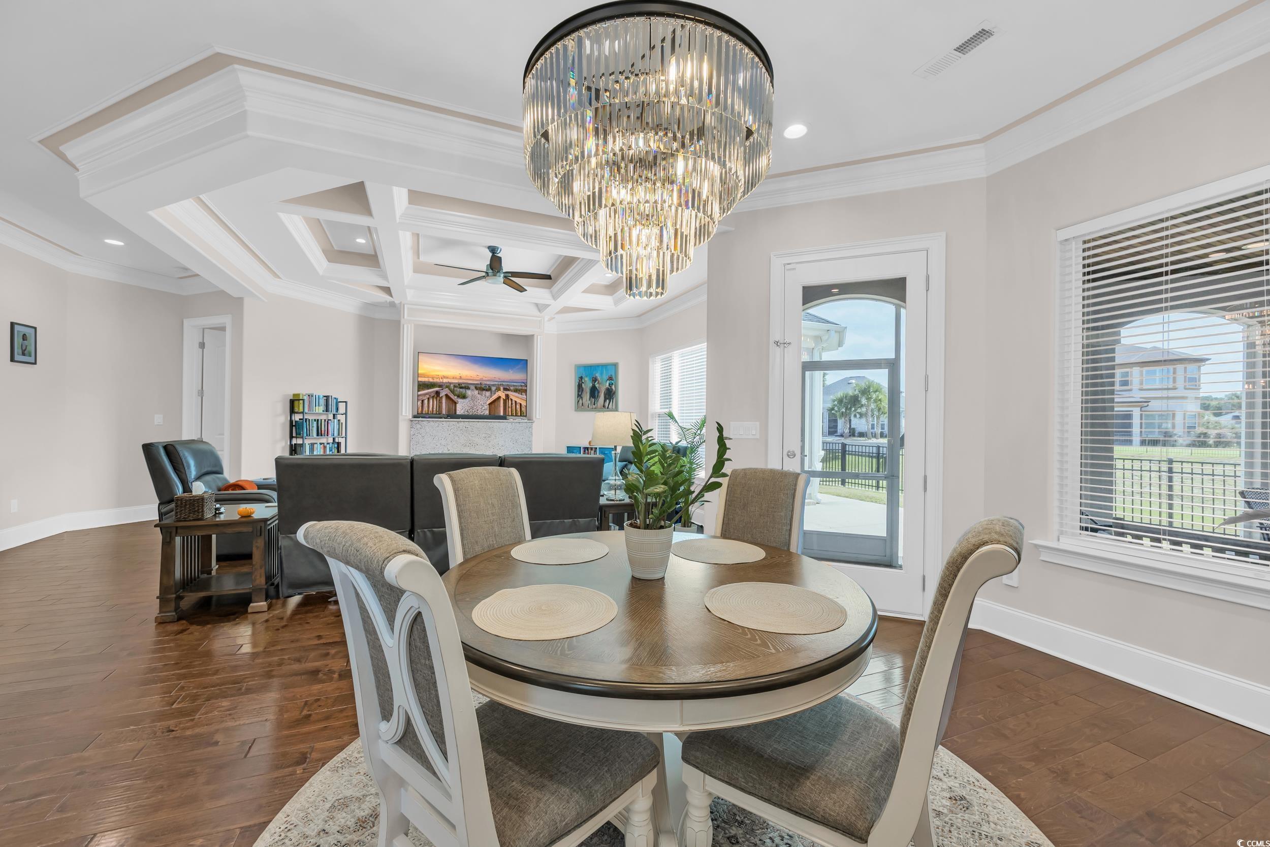 Image 2: Dining room featuring a chandelier, coffered ceili Image 2: Dining room featuring a chandelier, coffered ceili