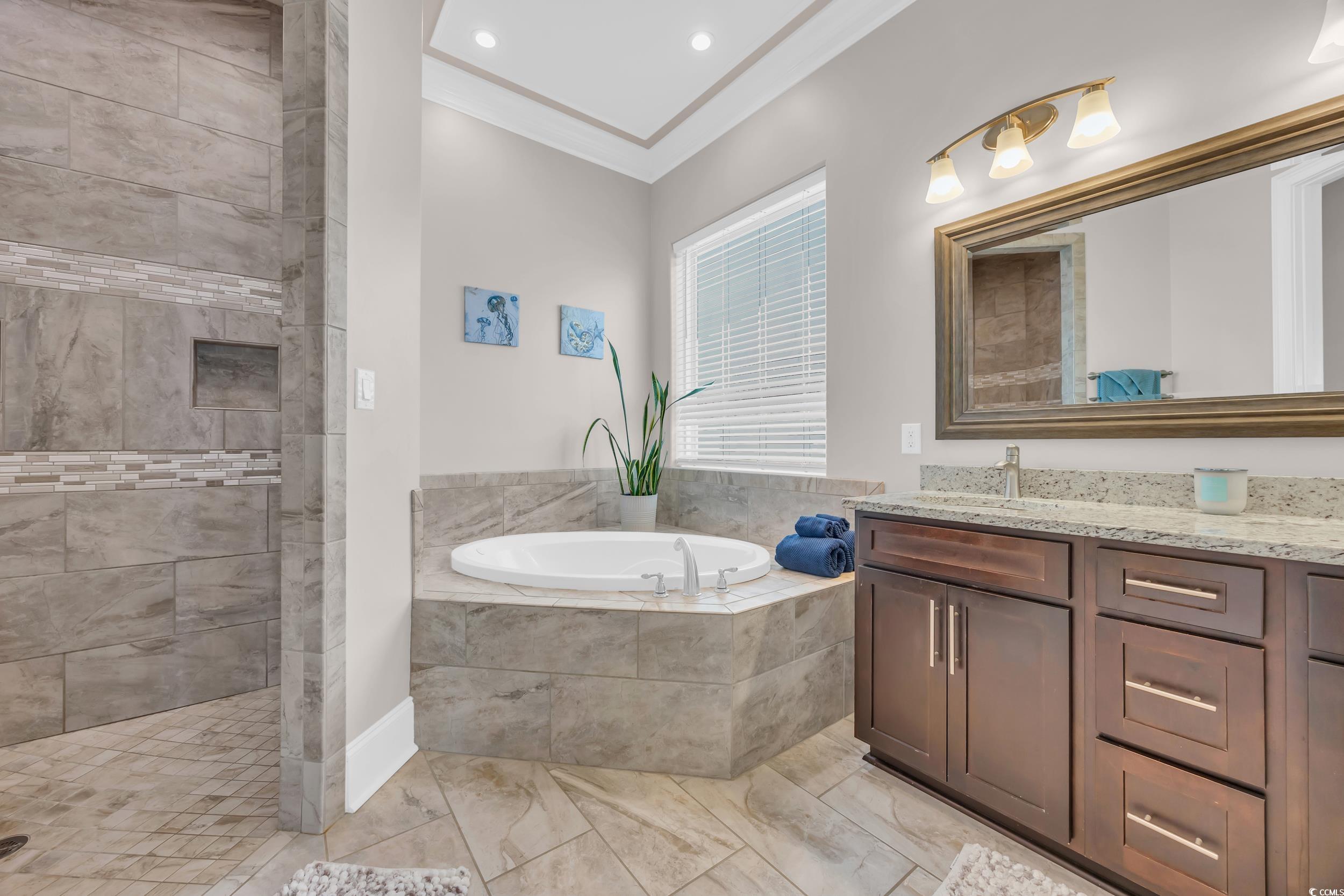 Image 4: Full bathroom with a garden tub, ornamental moldin Image 4: Full bathroom with a garden tub, ornamental moldin