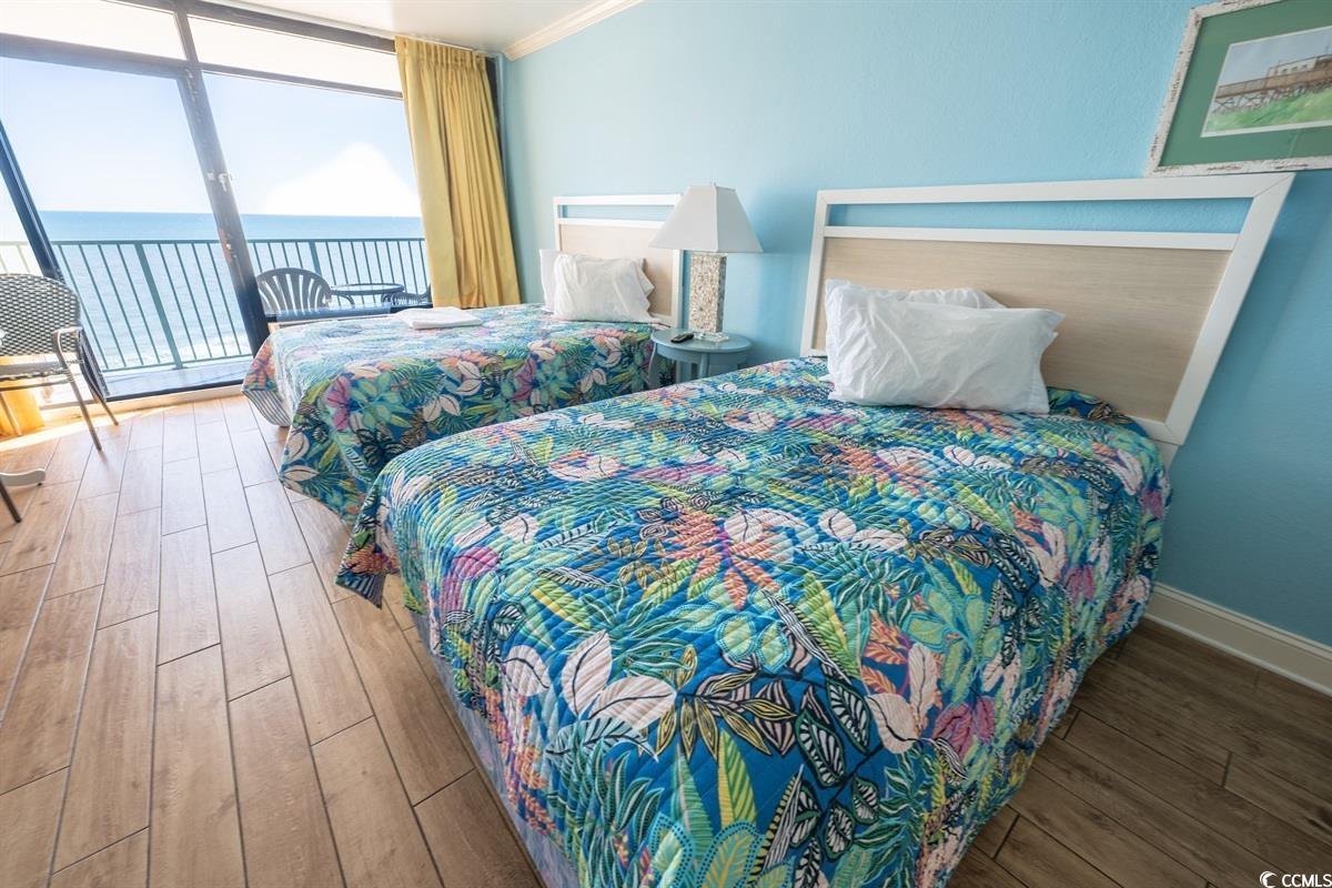 Image 2: Bedroom featuring access to outside, floor to ceil Image 2: Bedroom featuring access to outside, floor to ceil