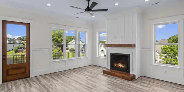 Image 2: Unfurnished living room with a decorative wall, wo Image 2: Unfurnished living room with a decorative wall, wo