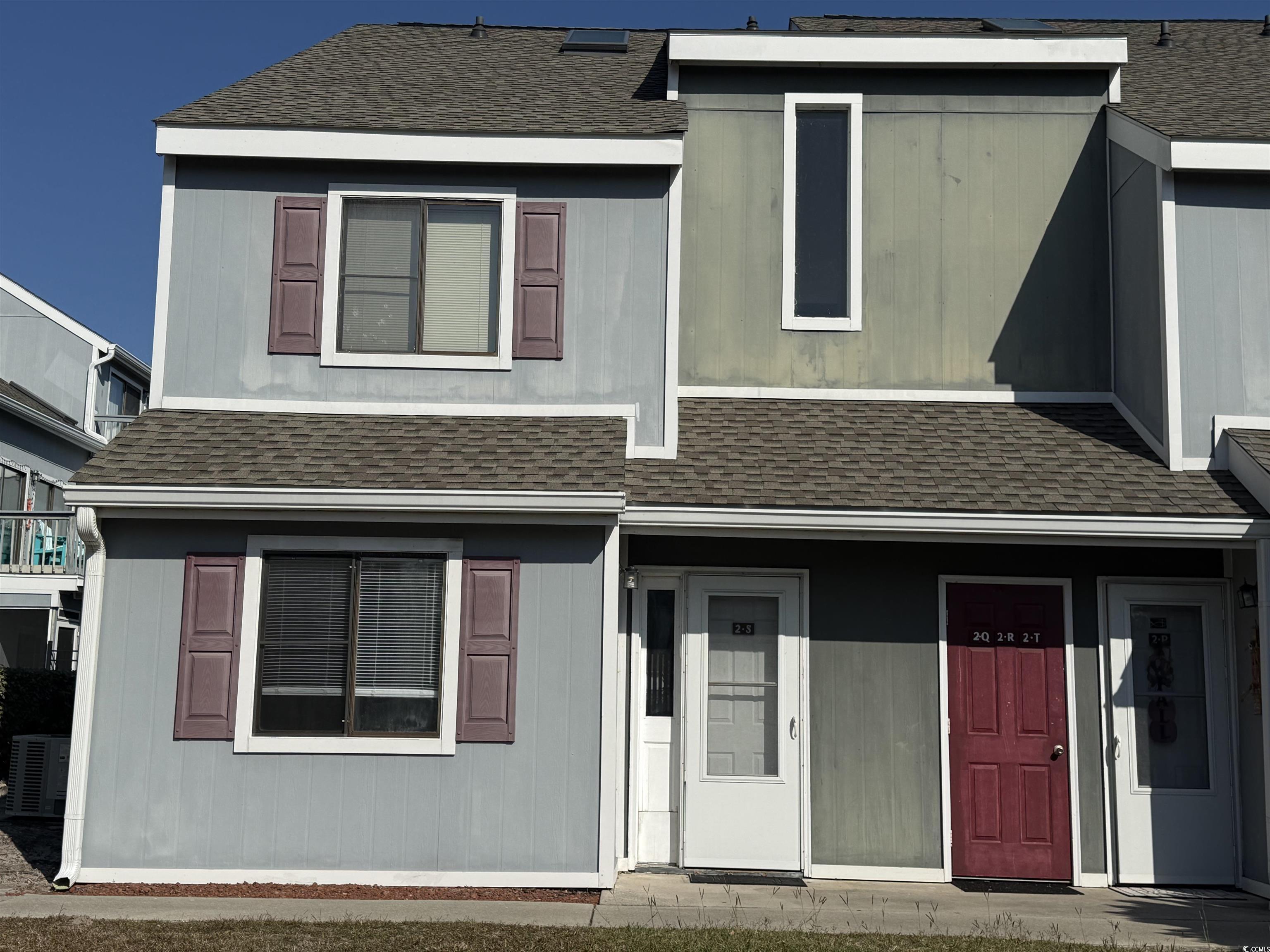 Image 1: View of front facade featuring a shingled roof and Image 1: View of front facade featuring a shingled roof and