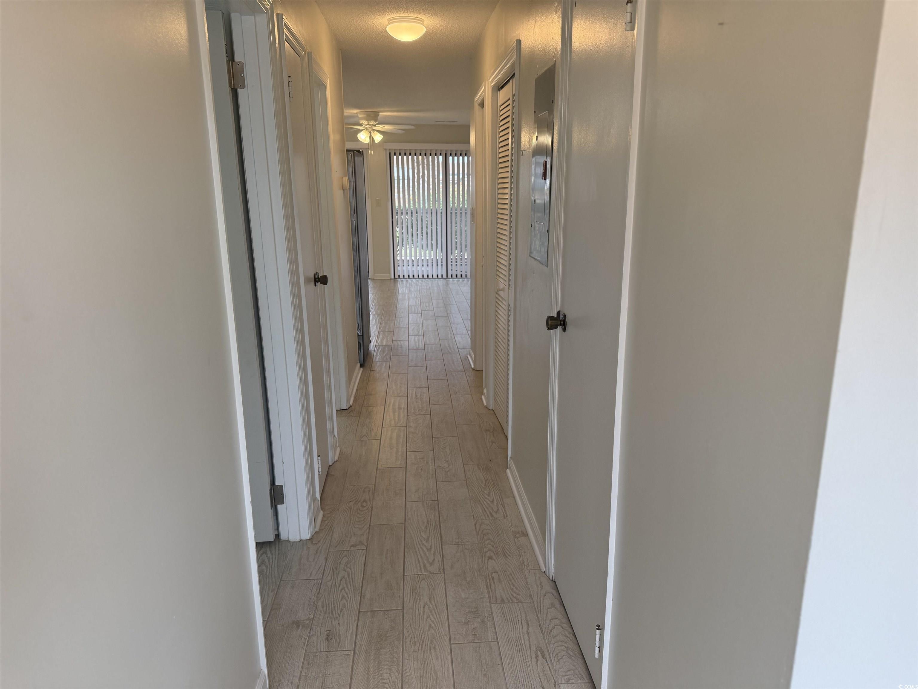 Image 2: Hallway with light wood-style flooring and baseboa Image 2: Hallway with light wood-style flooring and baseboa
