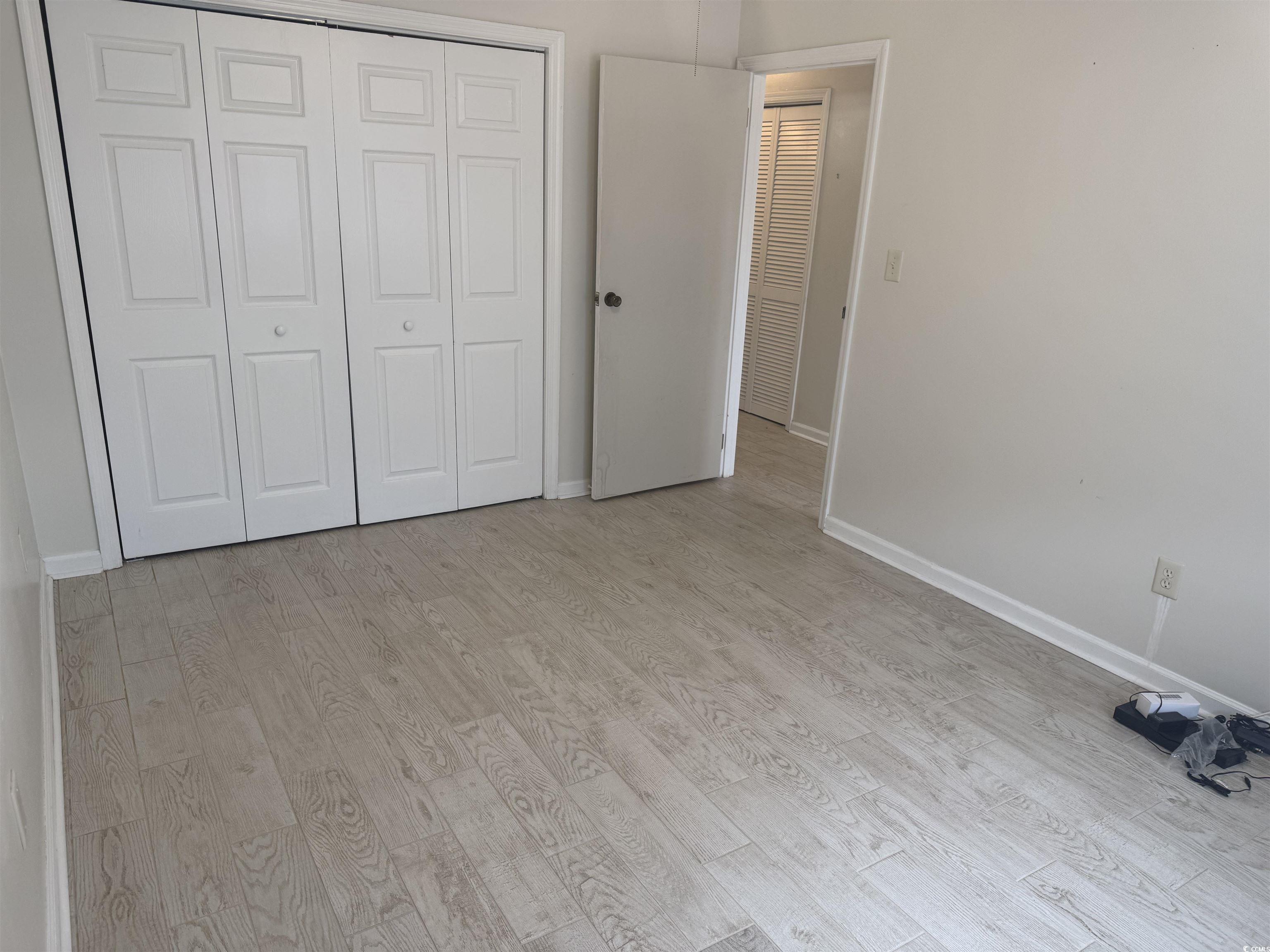 Image 3: Unfurnished bedroom featuring light wood finished Image 3: Unfurnished bedroom featuring light wood finished