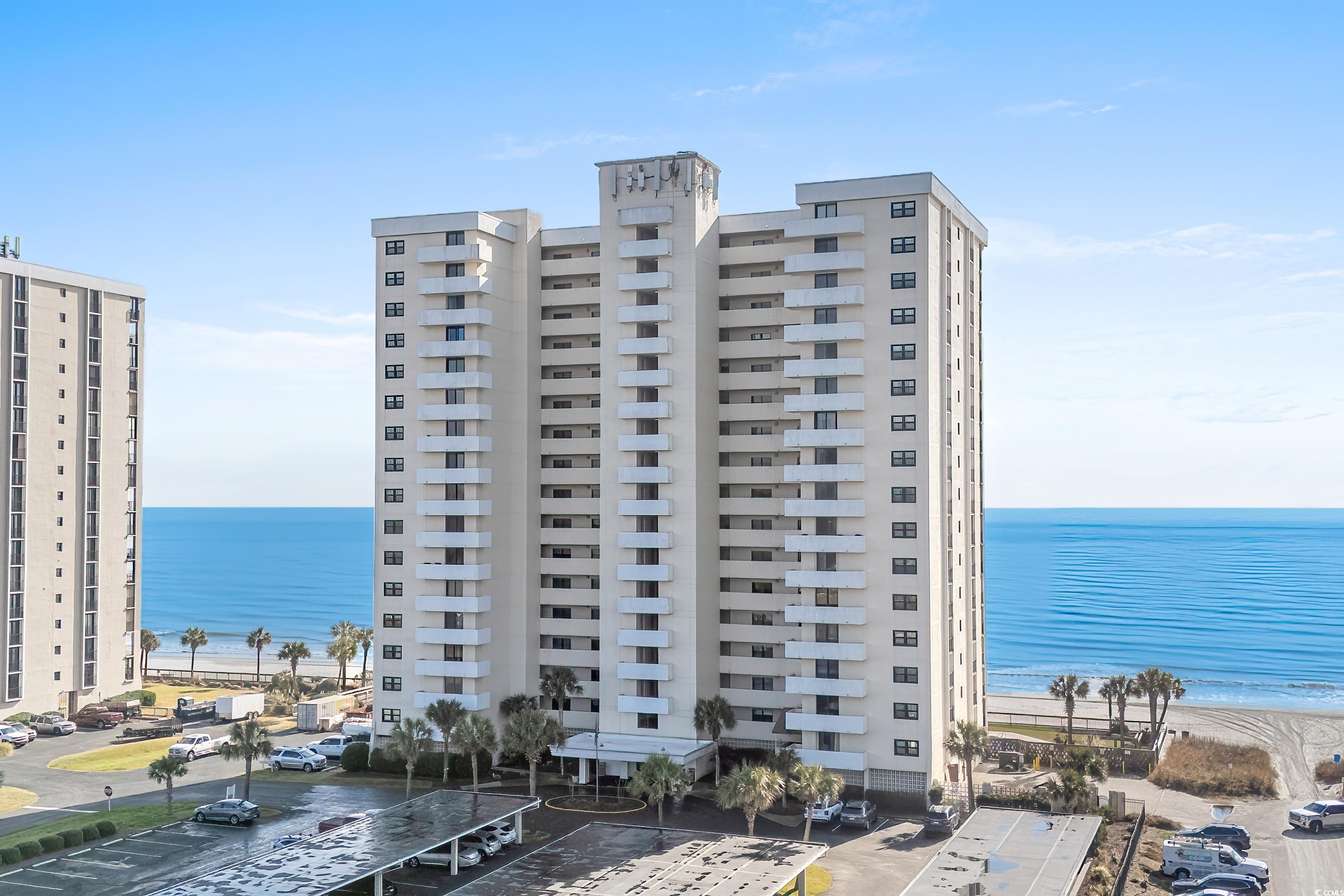 Image 1: View of apartment building / complex featuring a w Image 1: View of apartment building / complex featuring a w