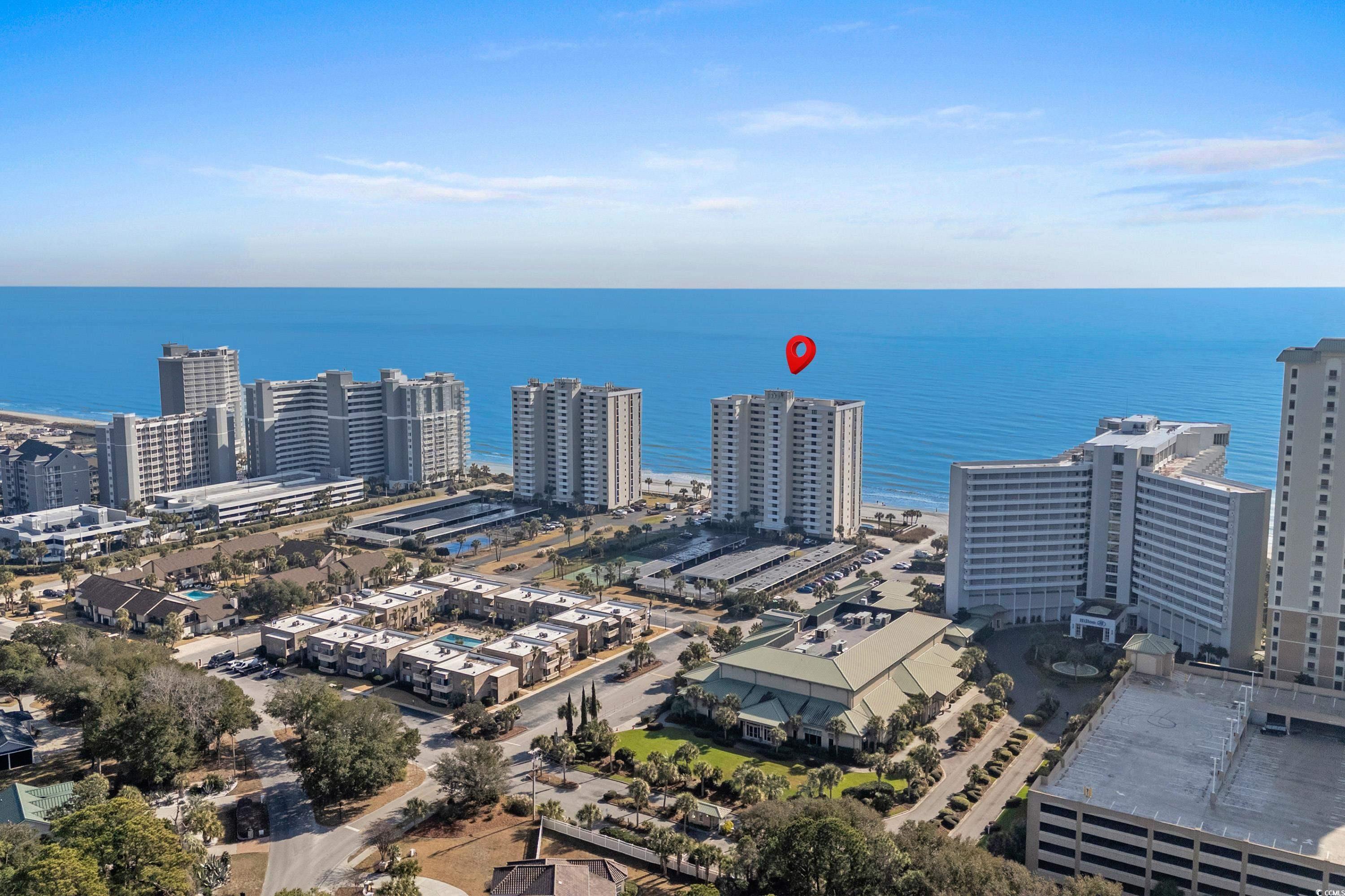 Image 2: View of urban area with a large body of water Image 2: View of urban area with a large body of water