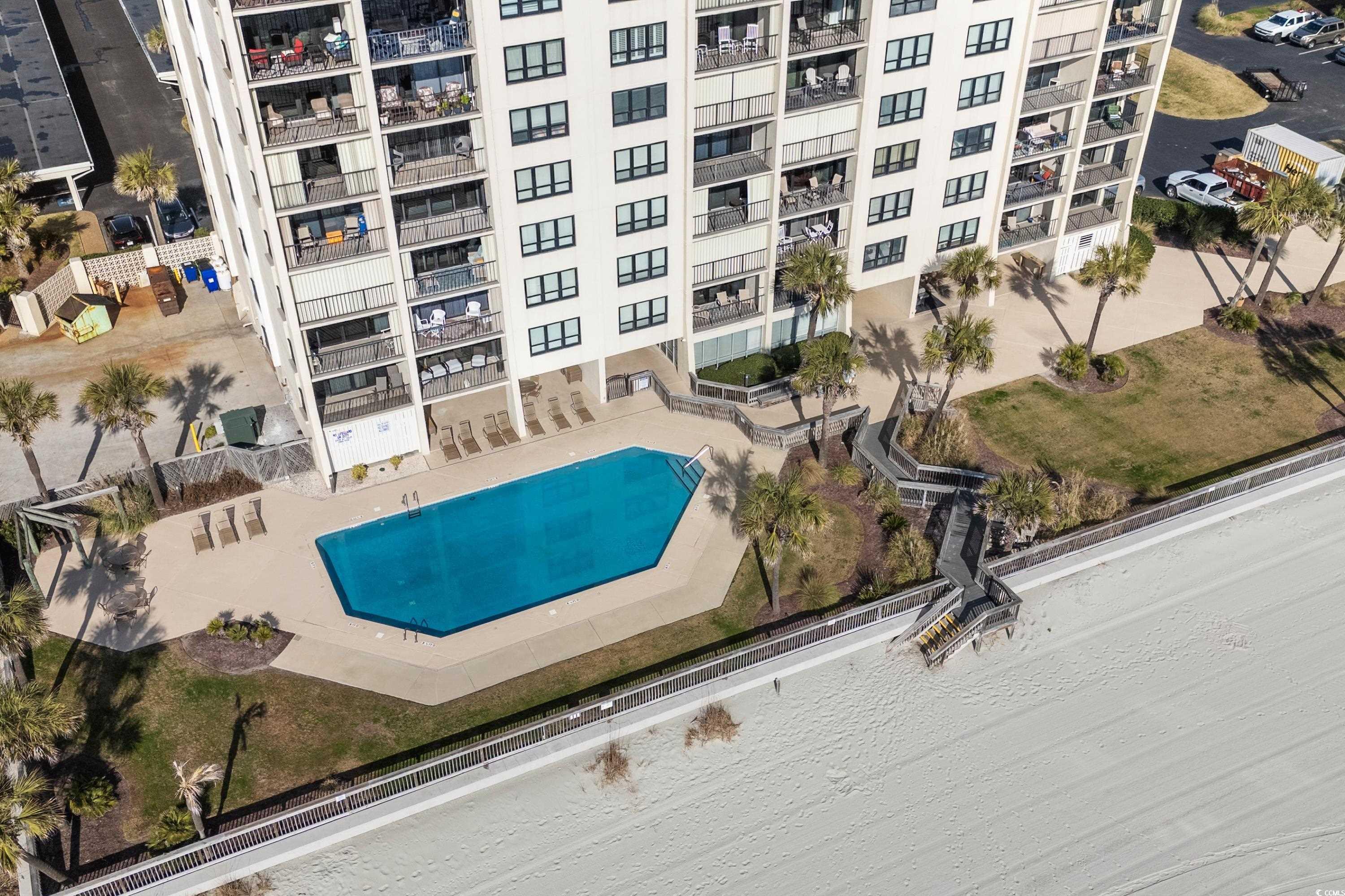 Image 4: Community pool featuring a patio area Image 4: Community pool featuring a patio area