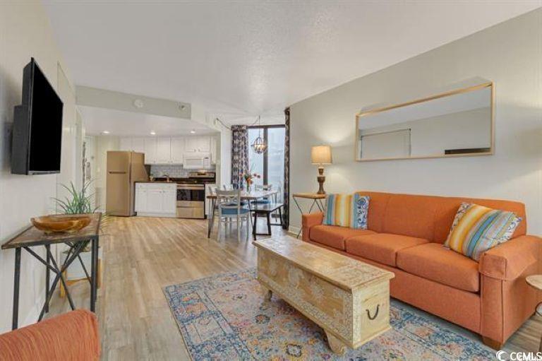 Image 4: Living room with light wood finished floors and a Image 4: Living room with light wood finished floors and a