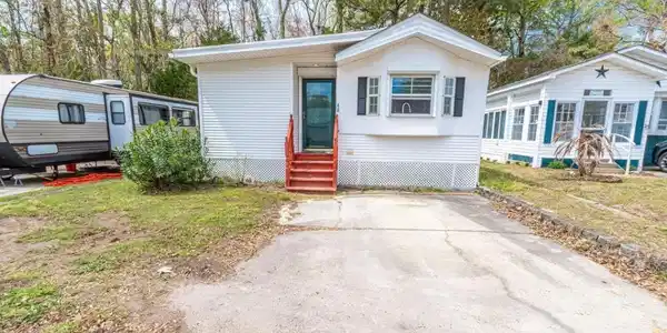 Image 2: Manufactured / mobile home with entry steps and a