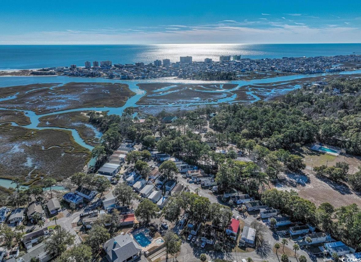 Image 4: View of urban area with a large body of water Image 4: View of urban area with a large body of water