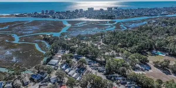 Image 4: View of urban area with a large body of water